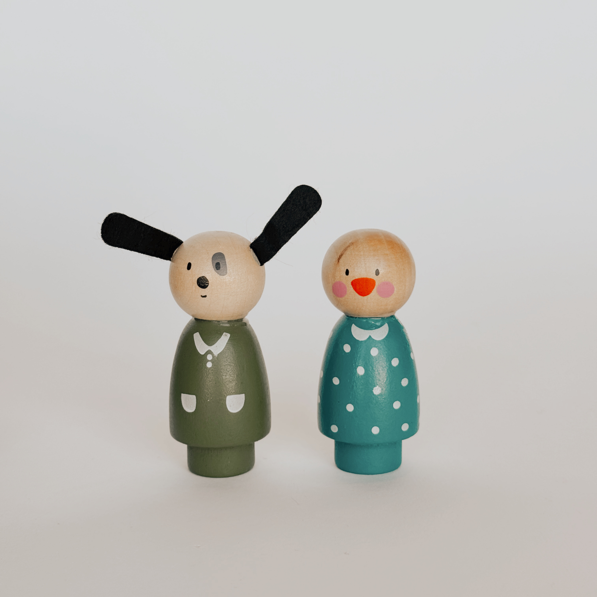 Moulin Roty Wood Family Set by Grace & Company: dog in green and person in teal polka-dot dress.