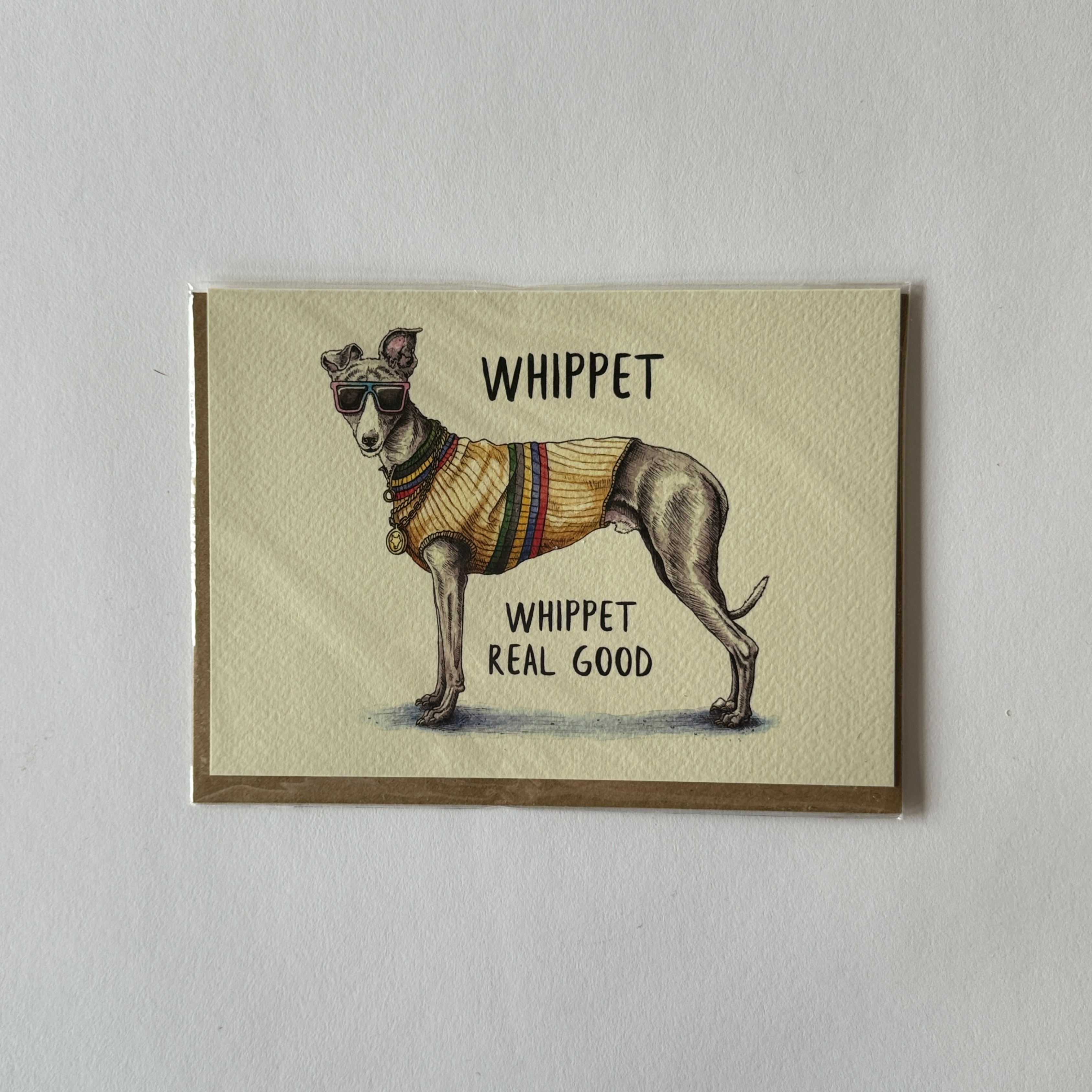 Bewilderbeet Everyday Card by Grace and Company Ltd: Whippet dog in sunglasses and sweater, text WHIPPET WHIPPET REAL GOOD.