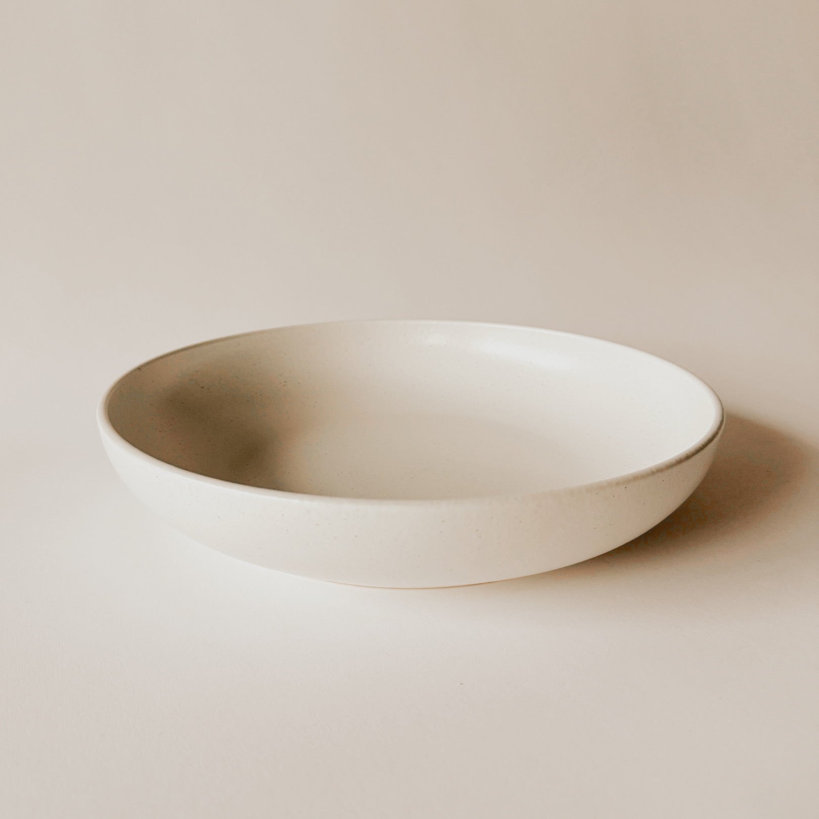 The Grace & Company Casafina Porto Large Pasta Bowl in Sea Salt on a light beige background.