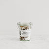 glass jar of aromatic flavored savory finishing salts