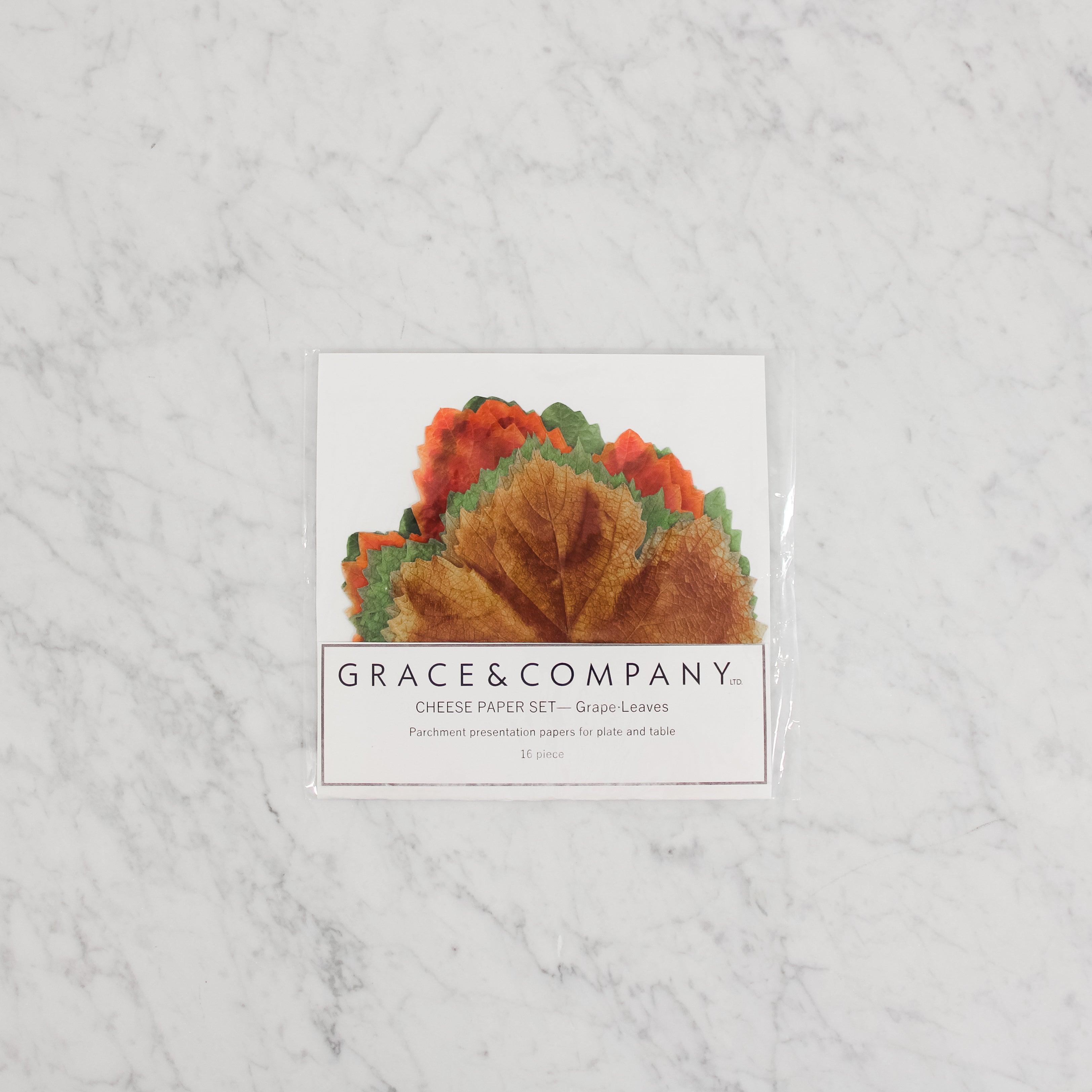 G&C Cheese Papers - Grape Leaves by Grace & Company ltd displayed on a marble surface.