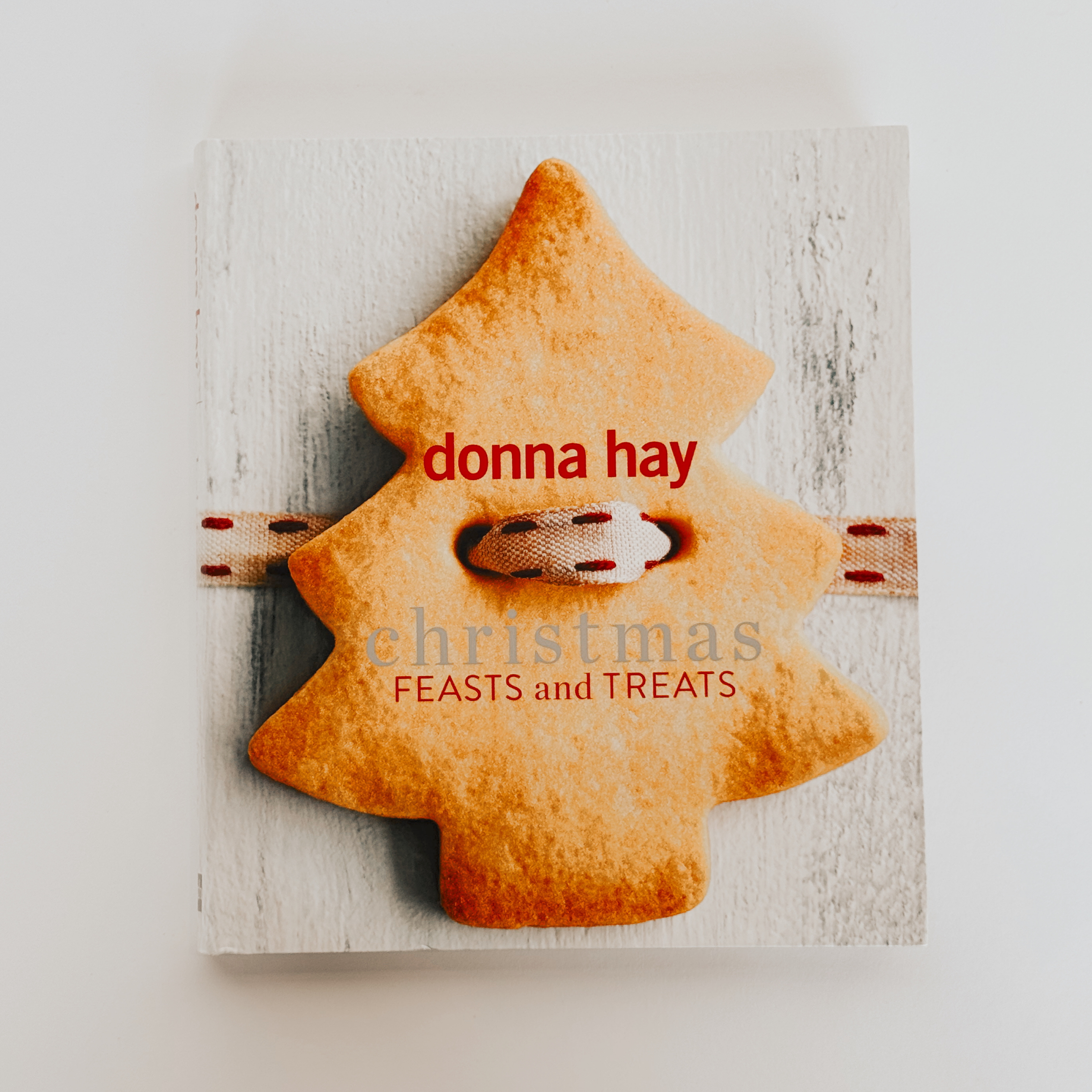 Donna Hay - Christmas Feasts and Treats by Grace & Company, featuring a tree-shaped cookie on its cover.