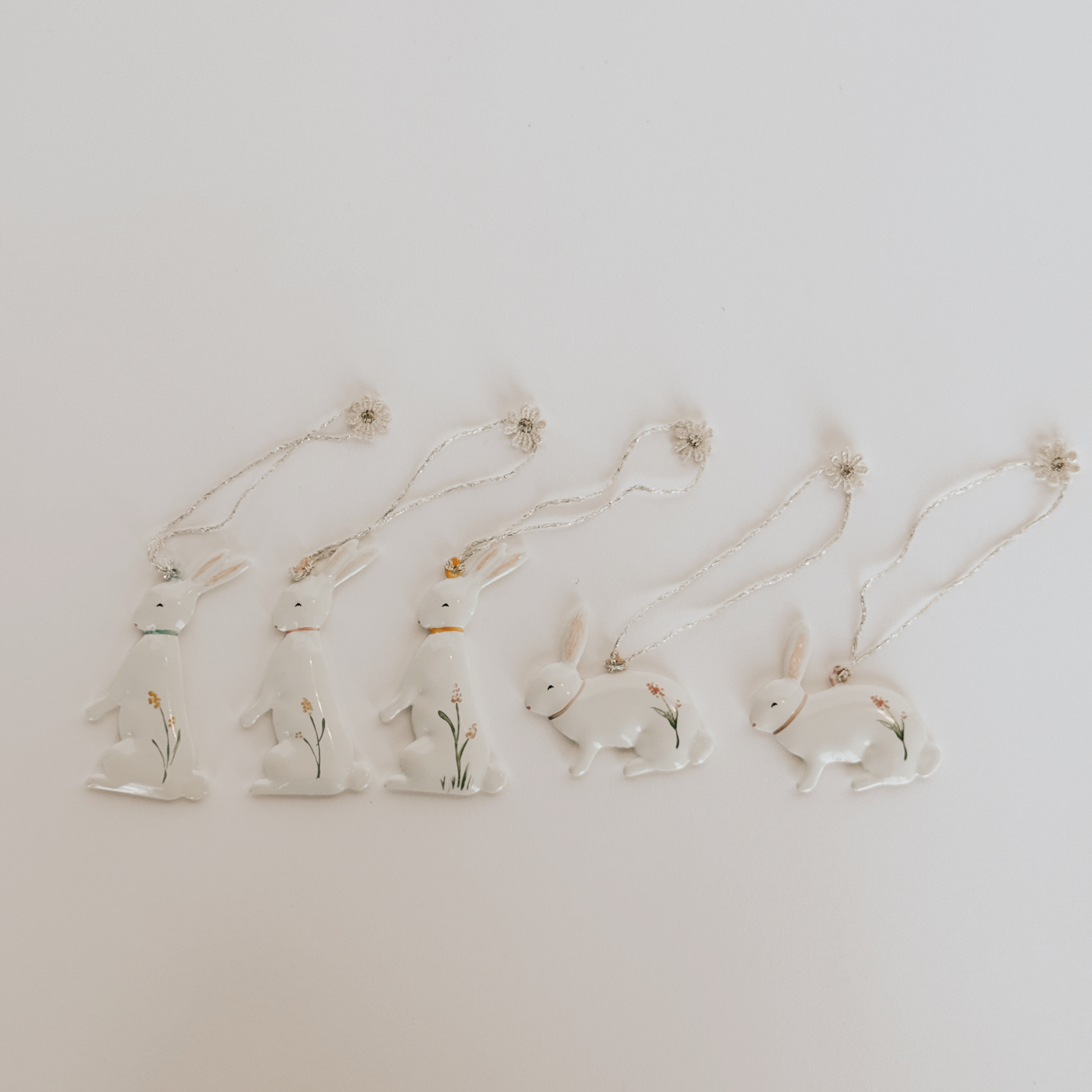 Five Maileg - Easter Bunny Metal Ornaments by Grace & Company, displayed in a row on a white background.