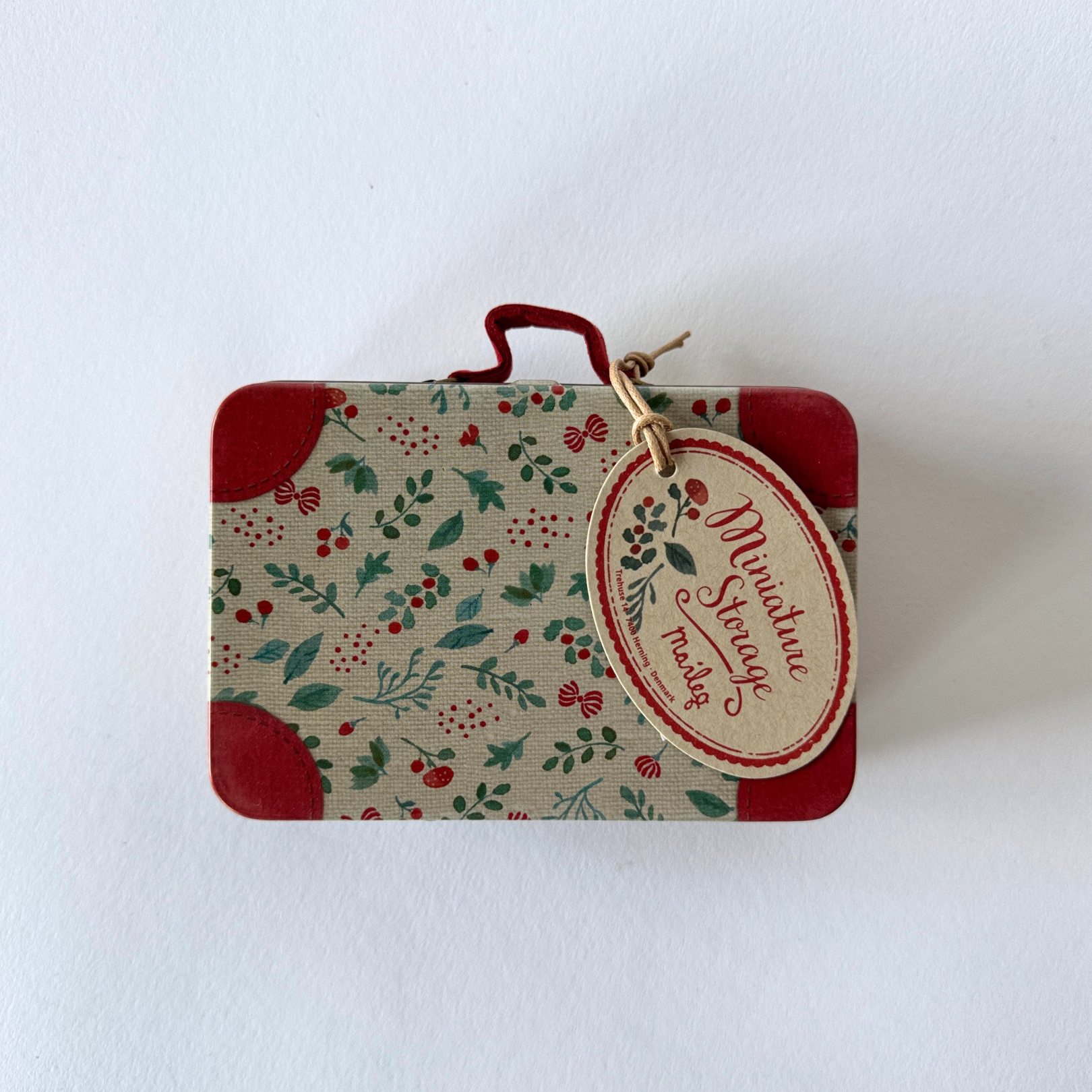 The Maileg - Holly Suitcase by Grace and Company Ltd features a floral pattern and a Miniature Storage tag.