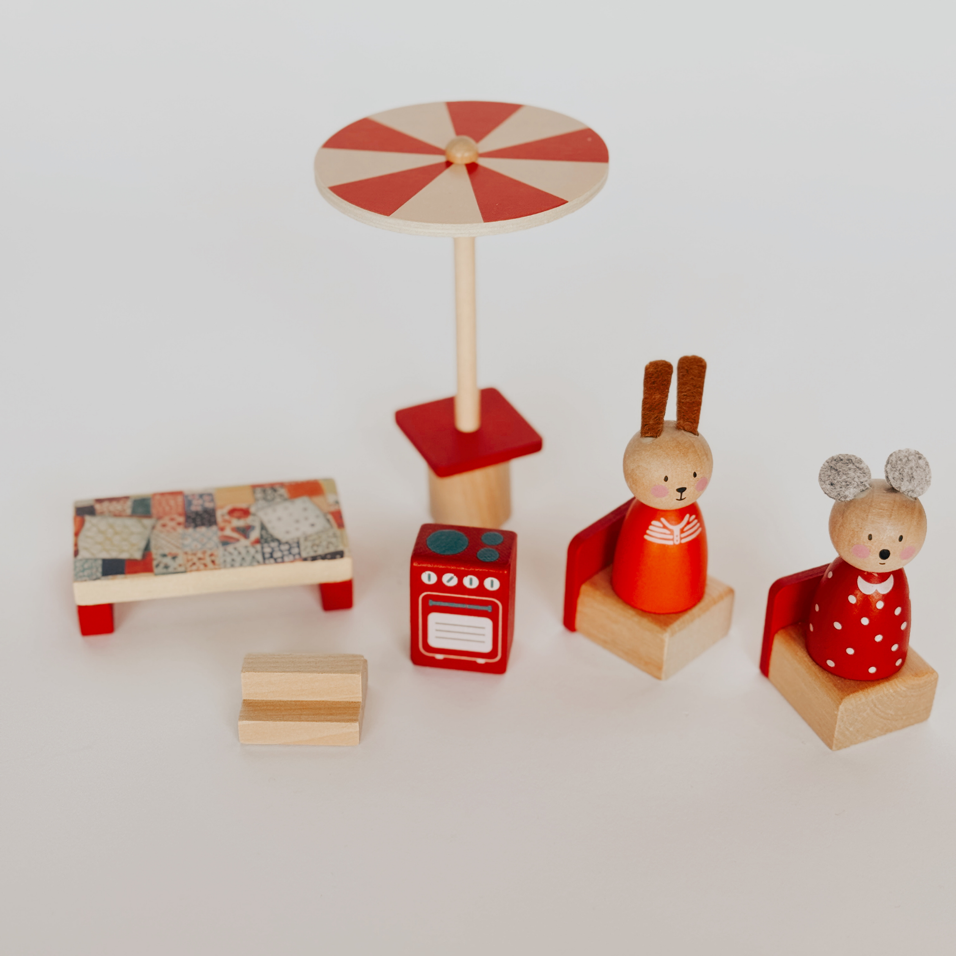 Grace & Company Moulin Roty Wood Family Set: 2 animal figures, table, oven, bed, and red-white umbrella.