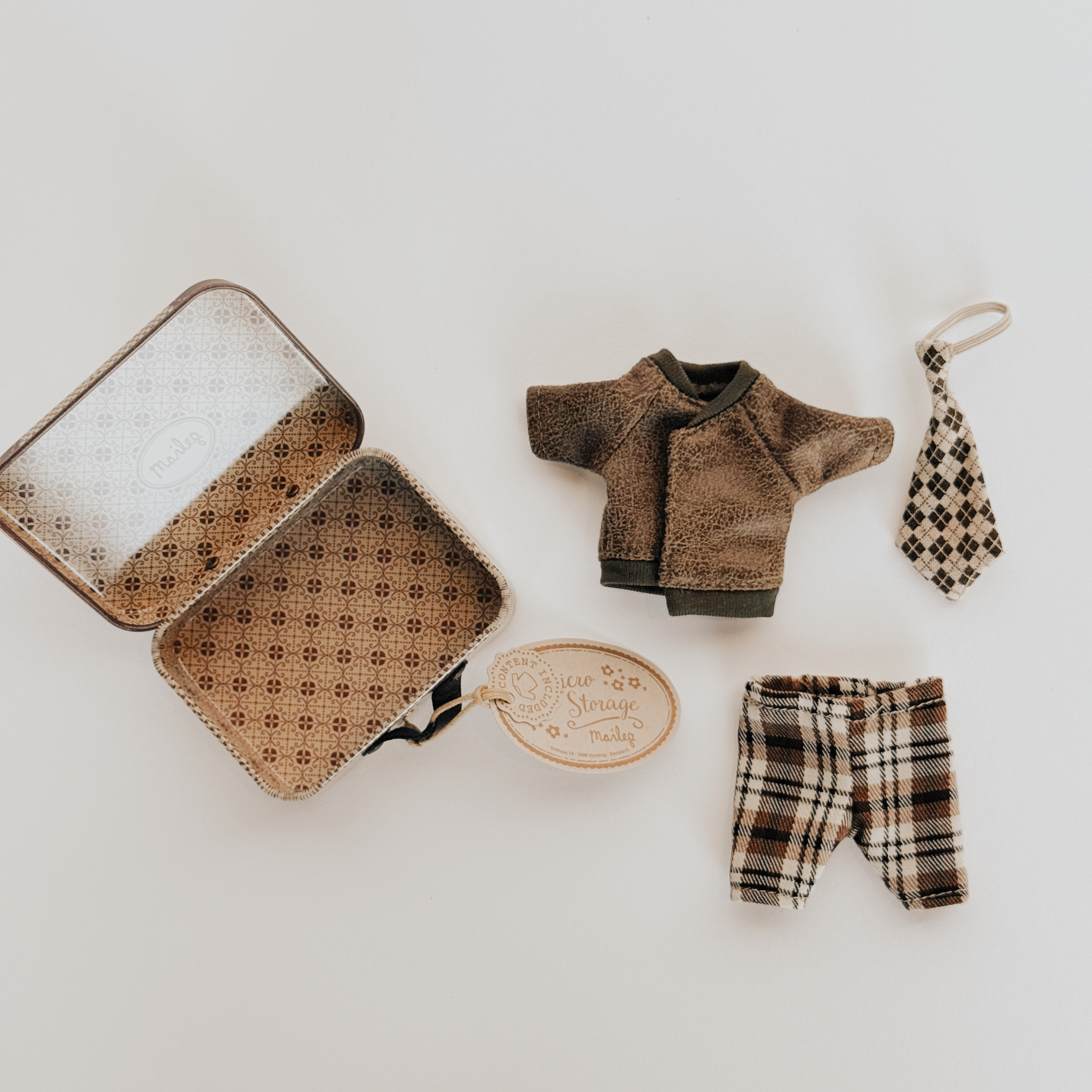 Maileg Jacket, pants & tie in suitcase by Grace & Company with Piece Storage label on a white background.