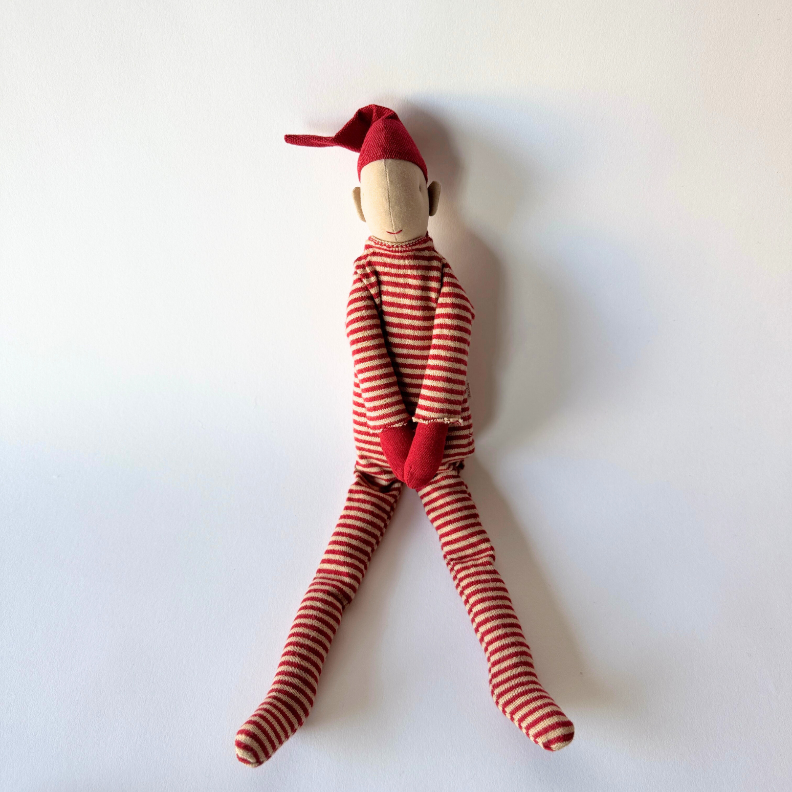 Maileg Long Legged Pixy in a Holiday Bag - Large by Grace and Company Ltd sits against a plain white background.