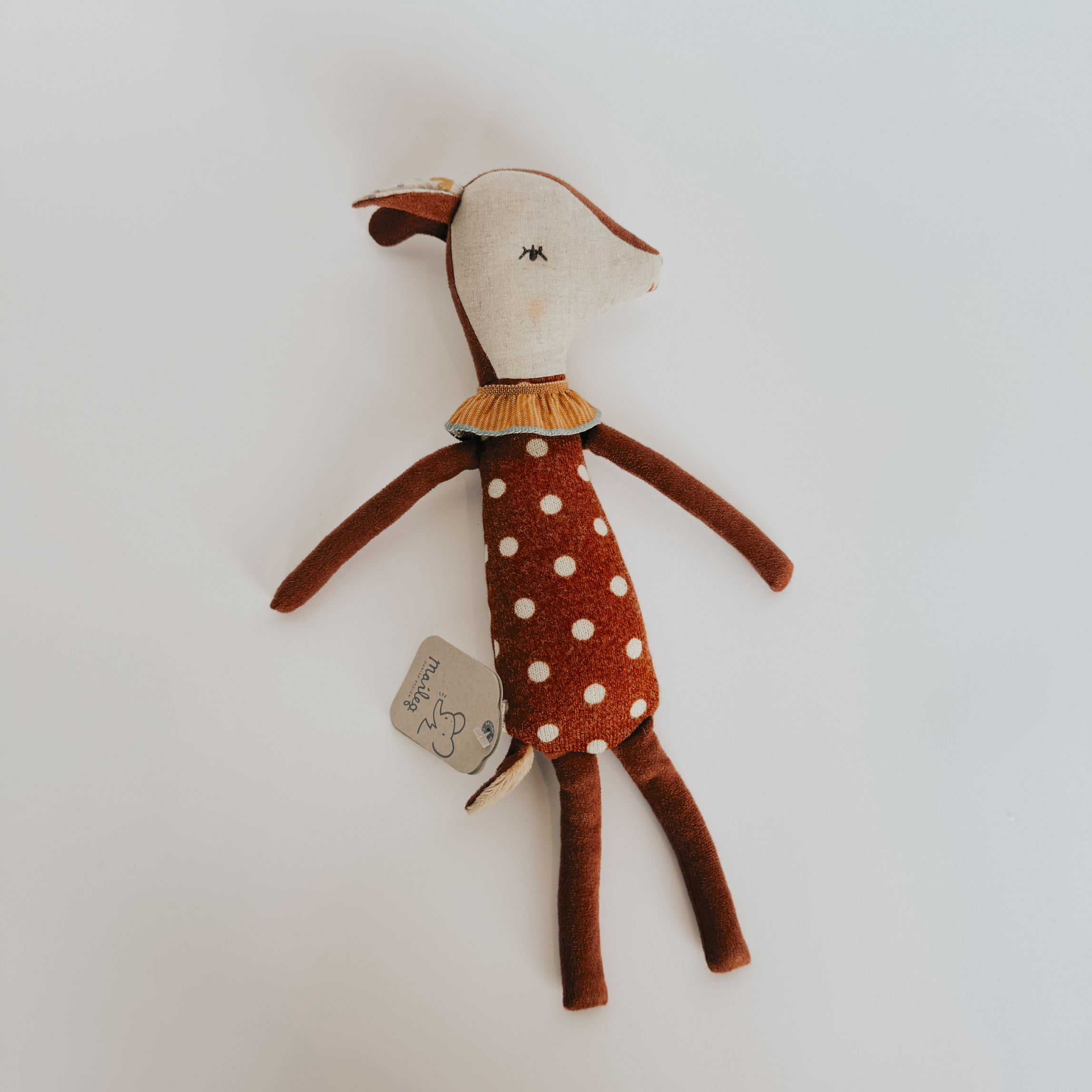 Maileg Sleepy/Wakey Bambi by Grace & Company ltd: a plush deer with brown fur, white dots, and yellow ruffled collar.