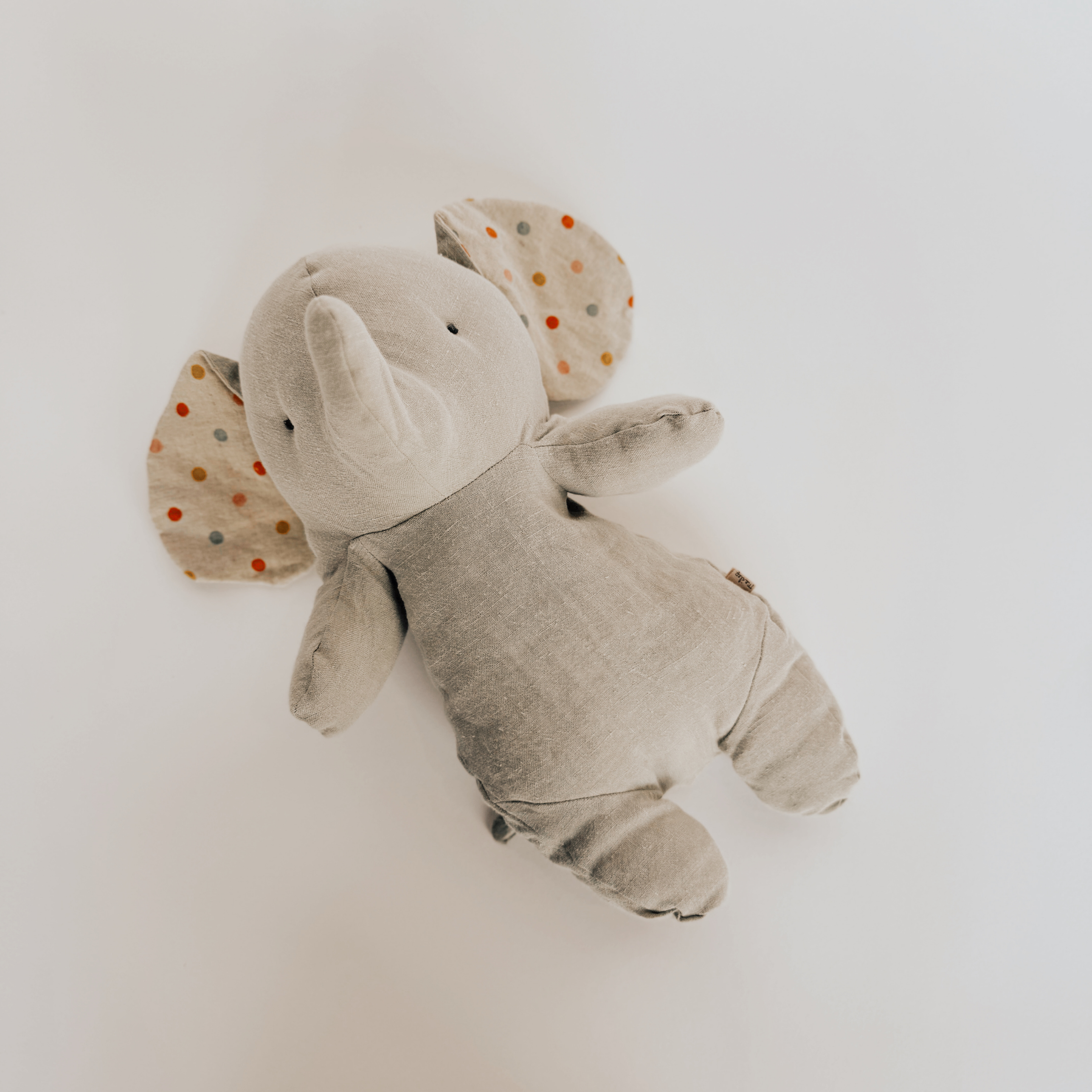 Maileg Lullaby Friends Elephant by Grace and Company Ltd, plush toy with polka-dot ears on white background.