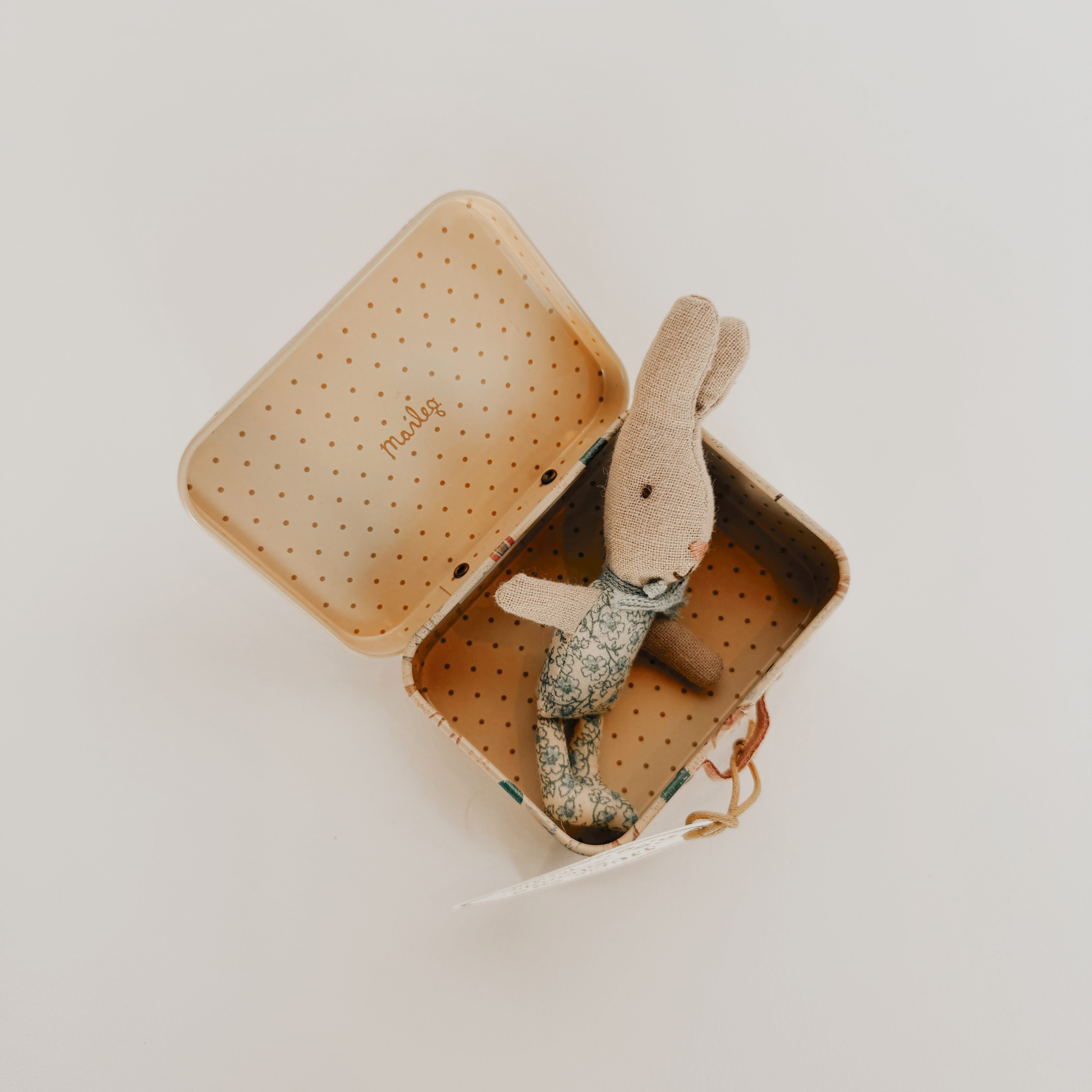 Maileg Micro Bunny in a floral outfit with suitcase by Grace & Company, shown on a white background, lid open.