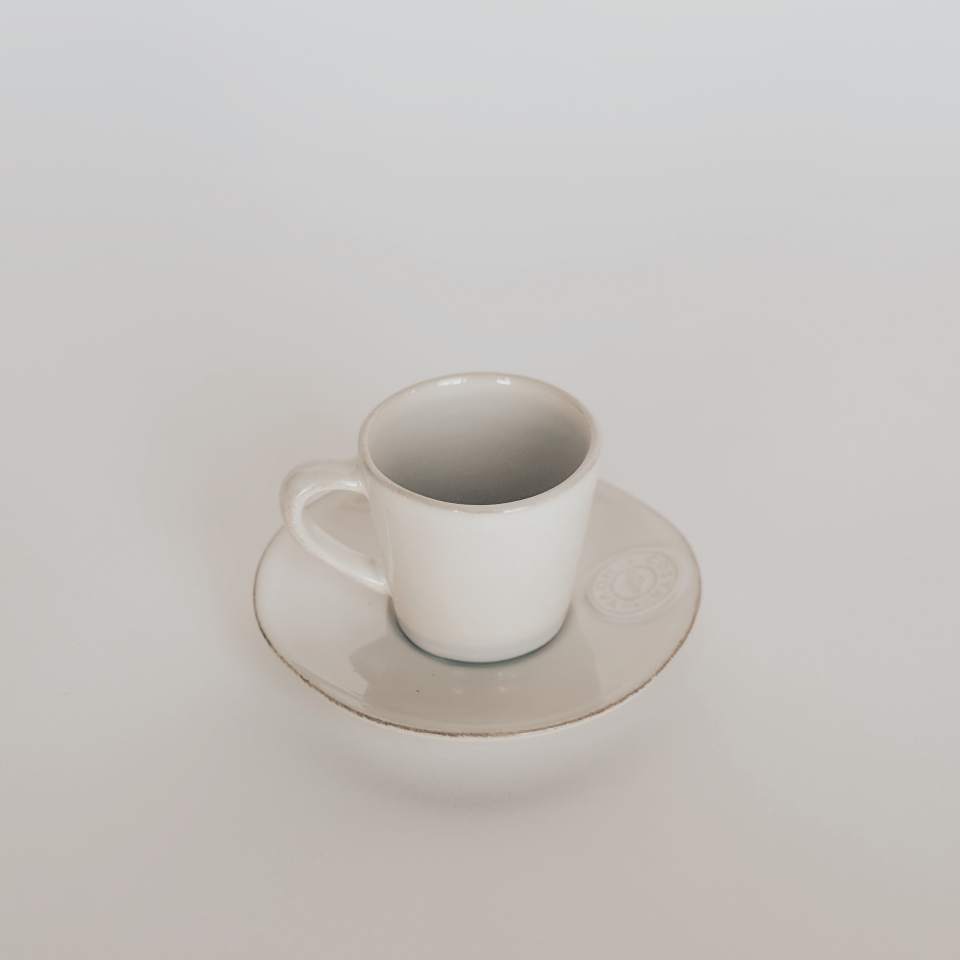 The Costa Nova Espresso Cup and Saucer by Grace & Company ltd sits against a plain white background.