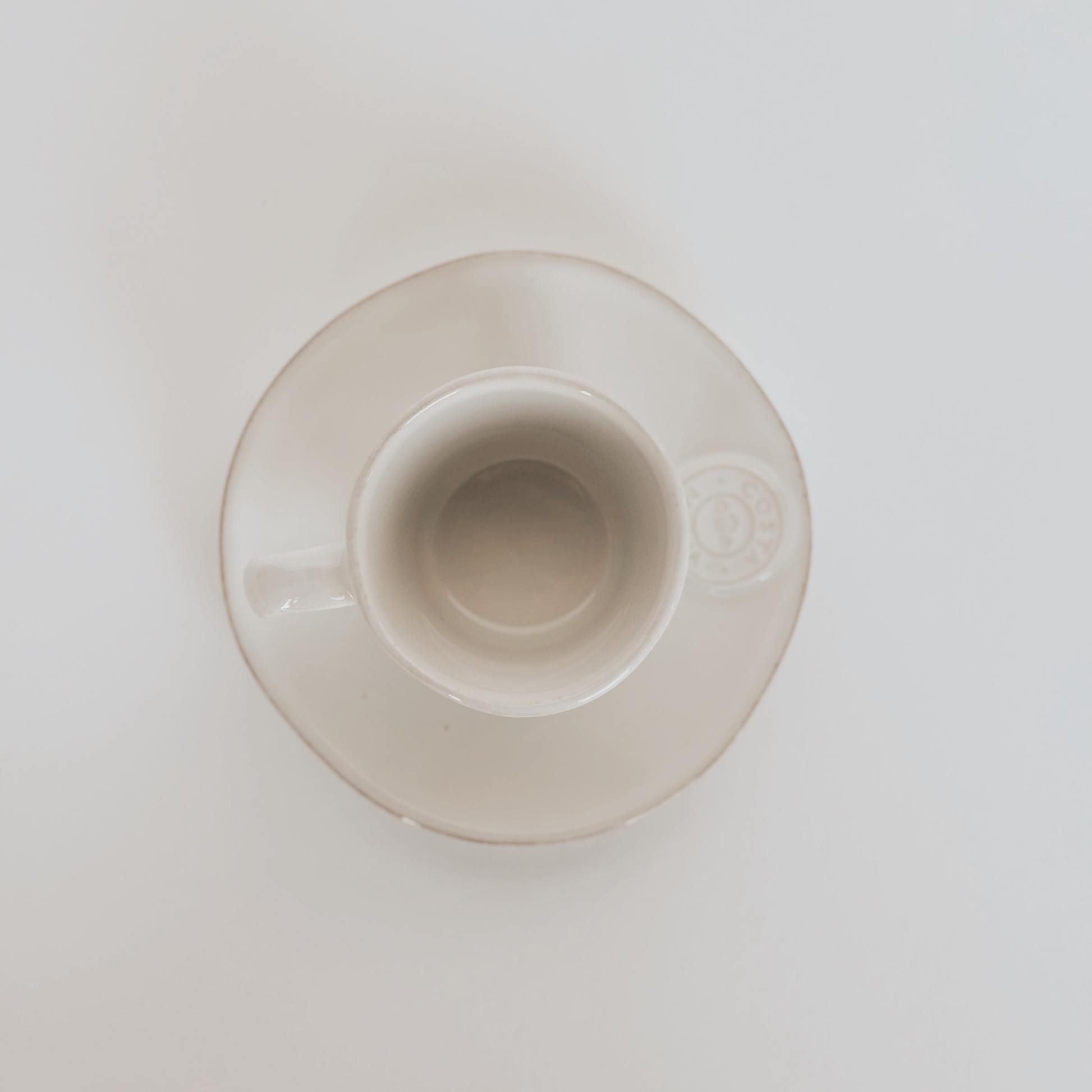 The Costa Nova Espresso Cup and Saucer by Grace & Company Ltd viewed from above on a plain white background.
