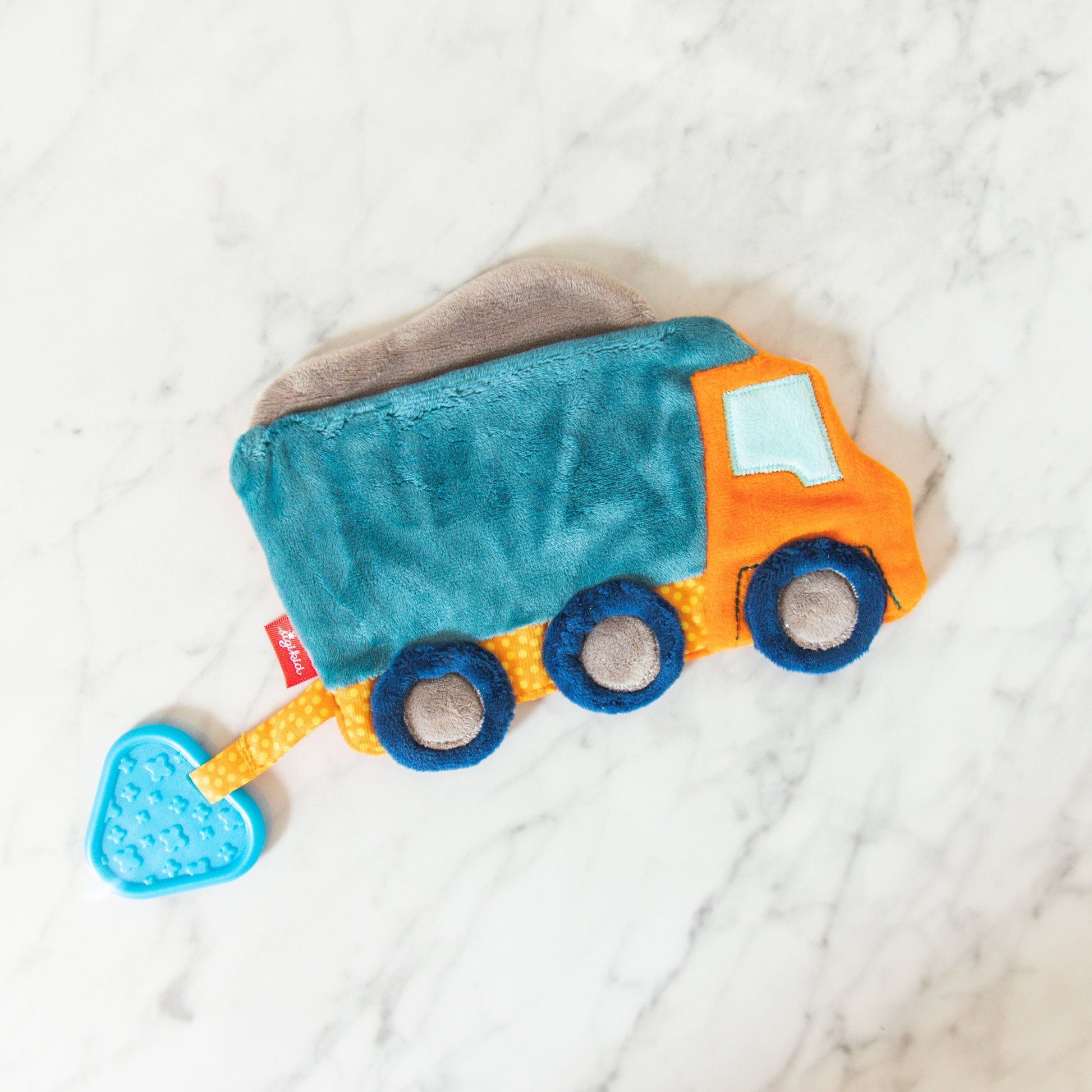 Grace & Company Sigykid Crinkle Toy: plush truck in blue, orange & gray with a blue heart-shaped teether.