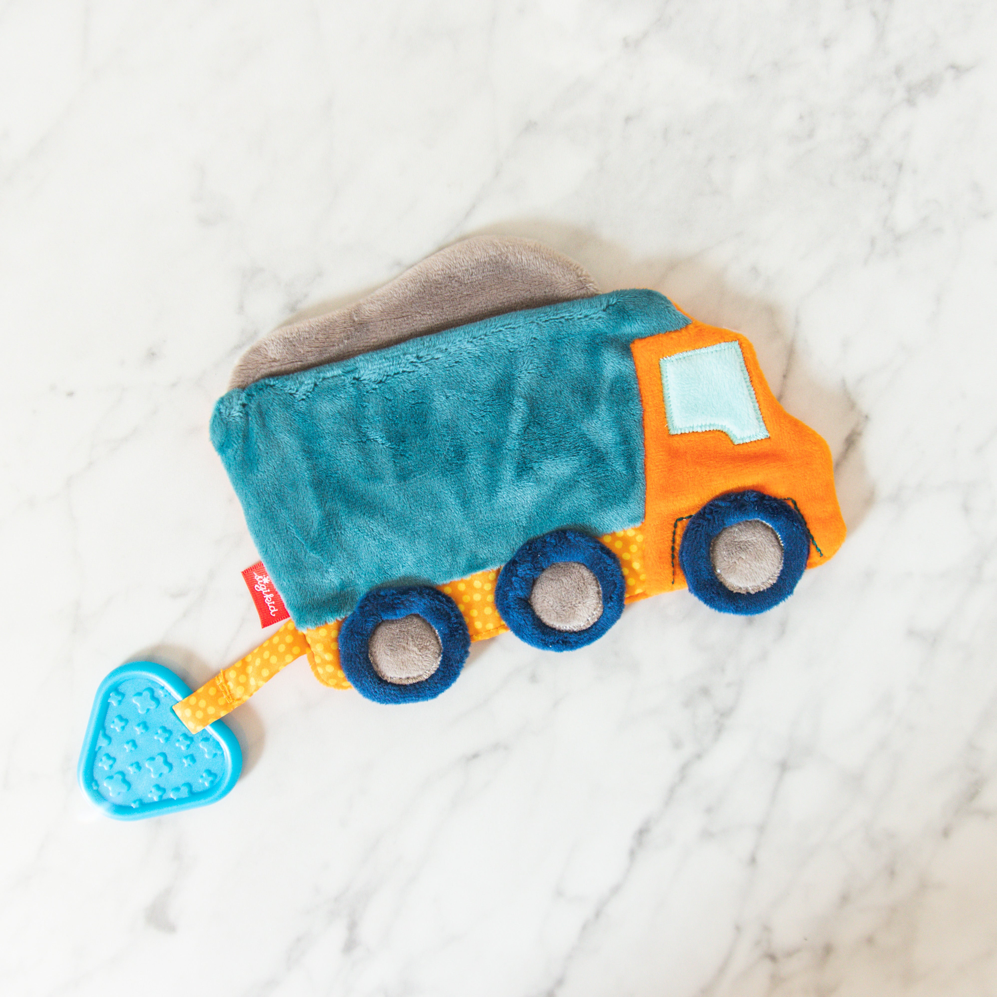 Grace & Company Sigykid Crinkle Toy: plush truck in blue, orange & gray with a blue heart-shaped teether.