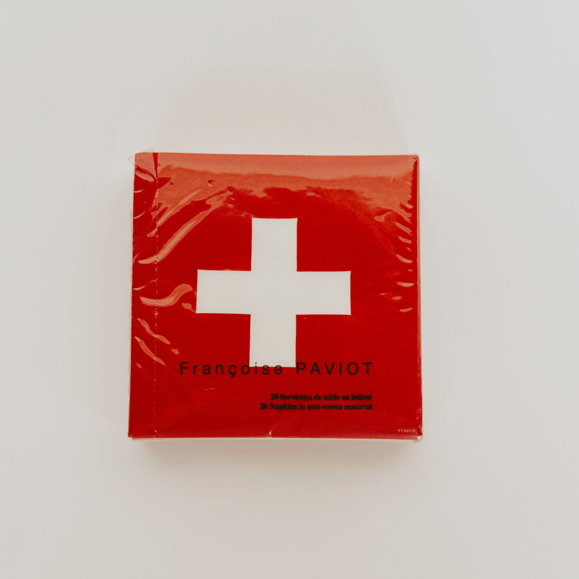 Paviot - Croix Swiss Napkins by Grace & Company ltd: red napkins with a white cross and Françoise PAVIOT on front.