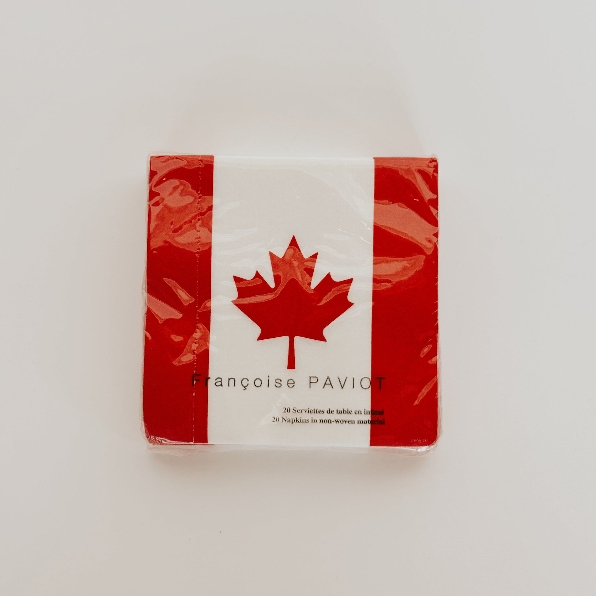 Grace & Company ltd Paviot - Canada Flag Napkins feature a red maple leaf and stripes on a white background.