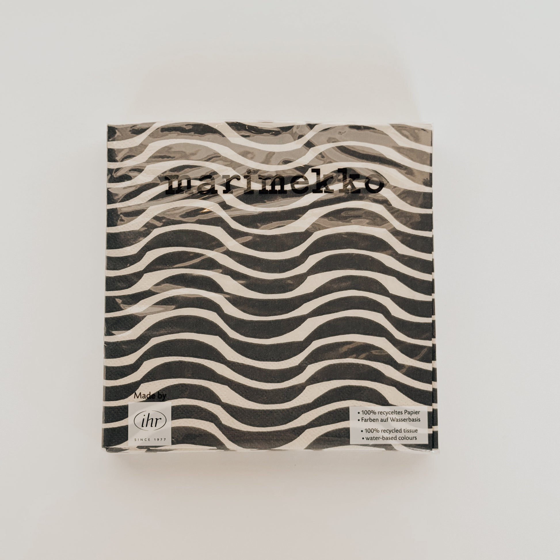 Marimekko - Palco Lunch Napkin by Grace and Company Ltd features a black and white wavy line design on the packaging.