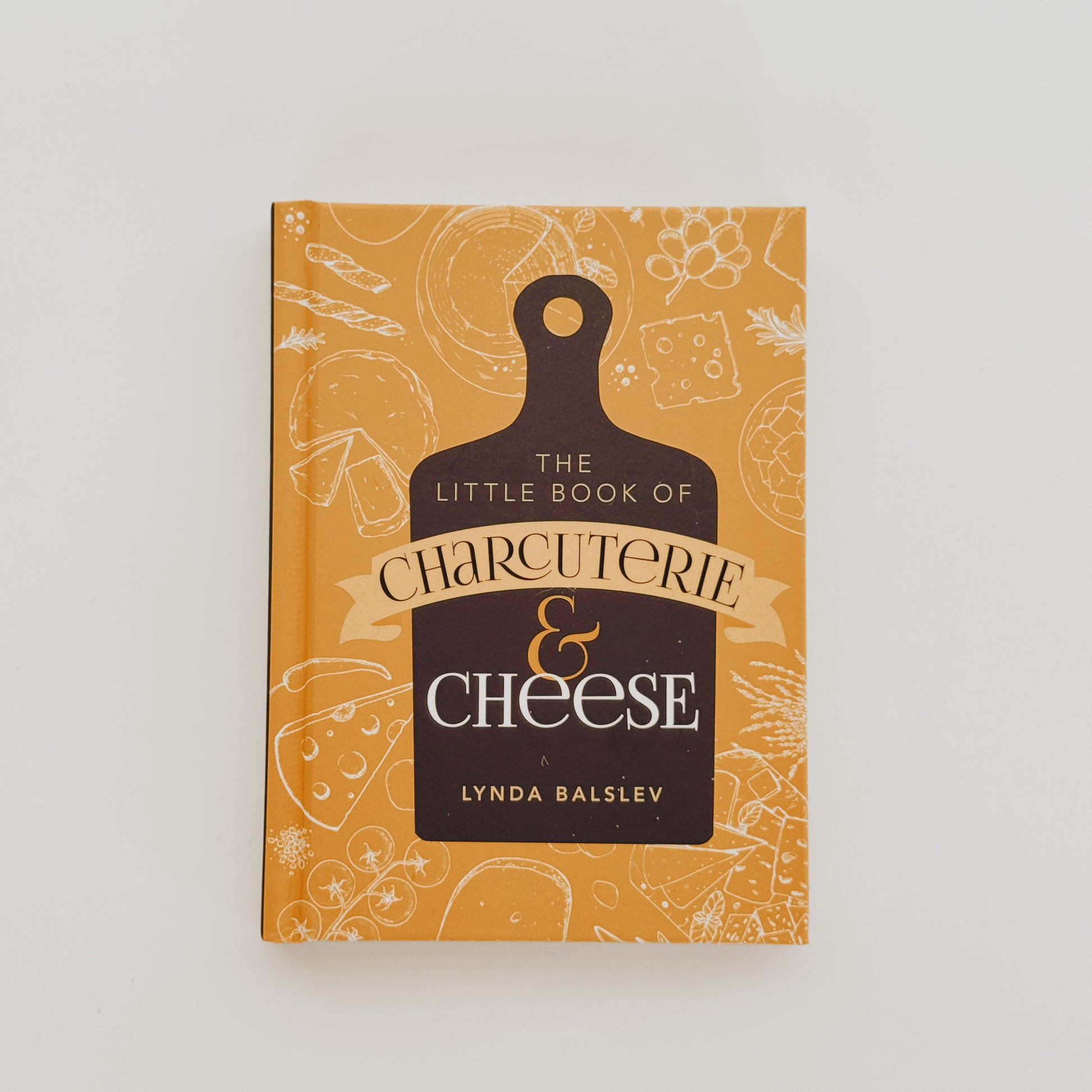 A yellow Grace & Company book, The Little Book of Charcuterie & Cheese, on a white background.