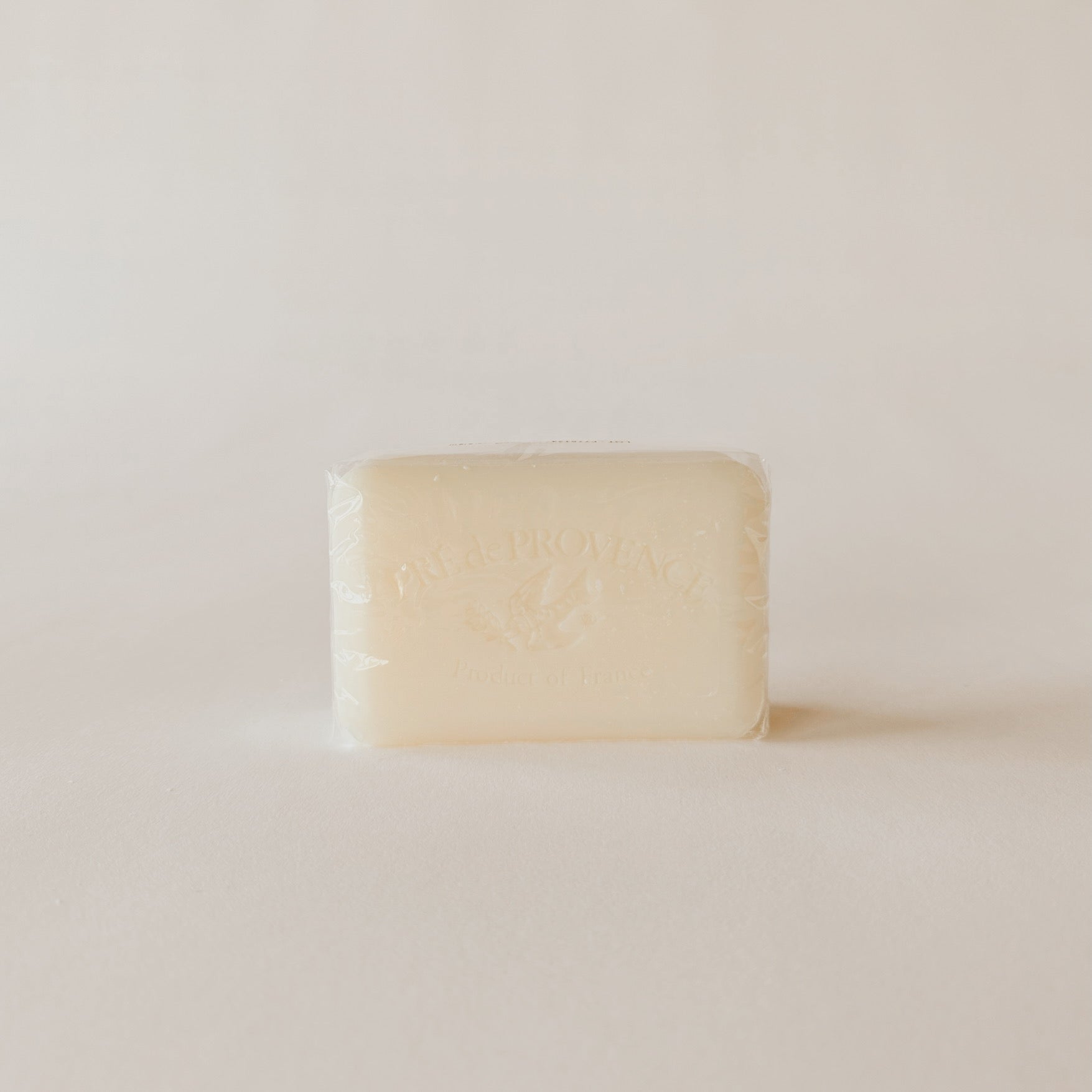 A rectangular bar of Pre de Provence Sea Salt French soap by Grace & Company ltd is wrapped in clear plastic.