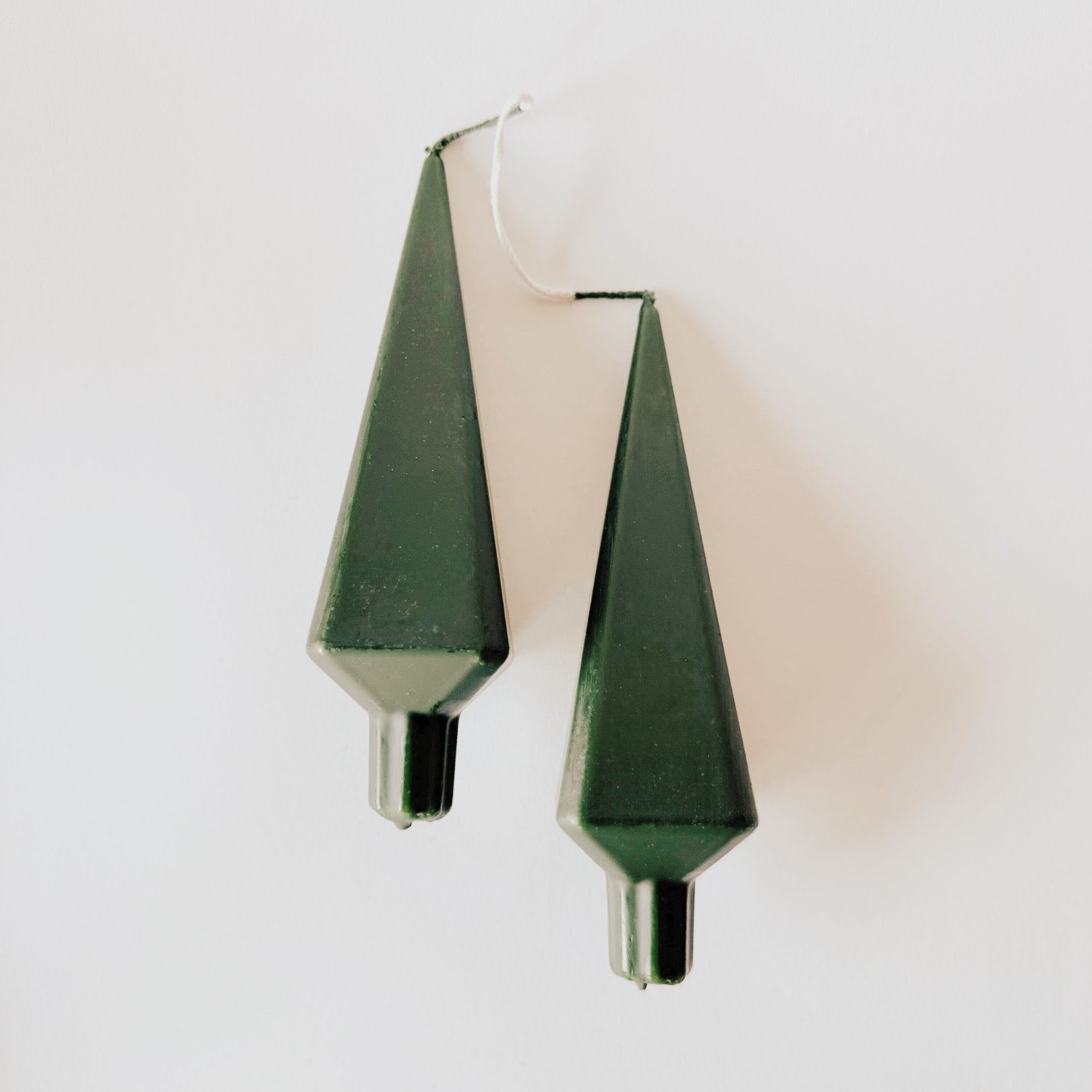Set of two green, cone-shaped Danish Candle - Tree Shape by Grace & Company, perfect for minimalist holiday décor.