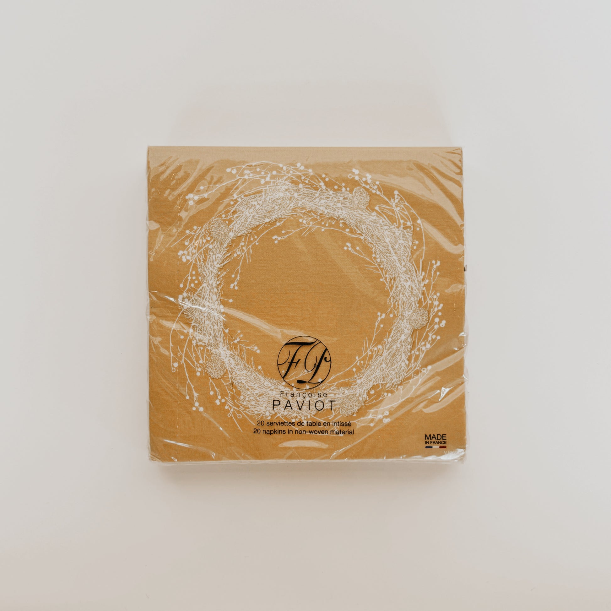 Paviot - Couronne napkin pack by Grace & Company, brown with a white wreath design, in clear plastic.