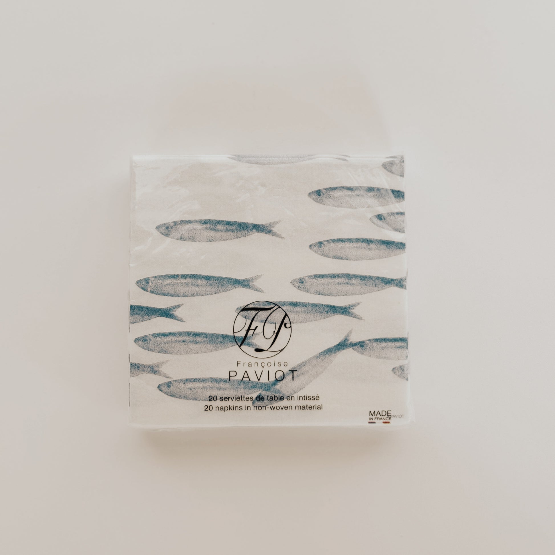 Paviot - Sardine Napkin by Grace & Company ltd features a fish design on a white background.