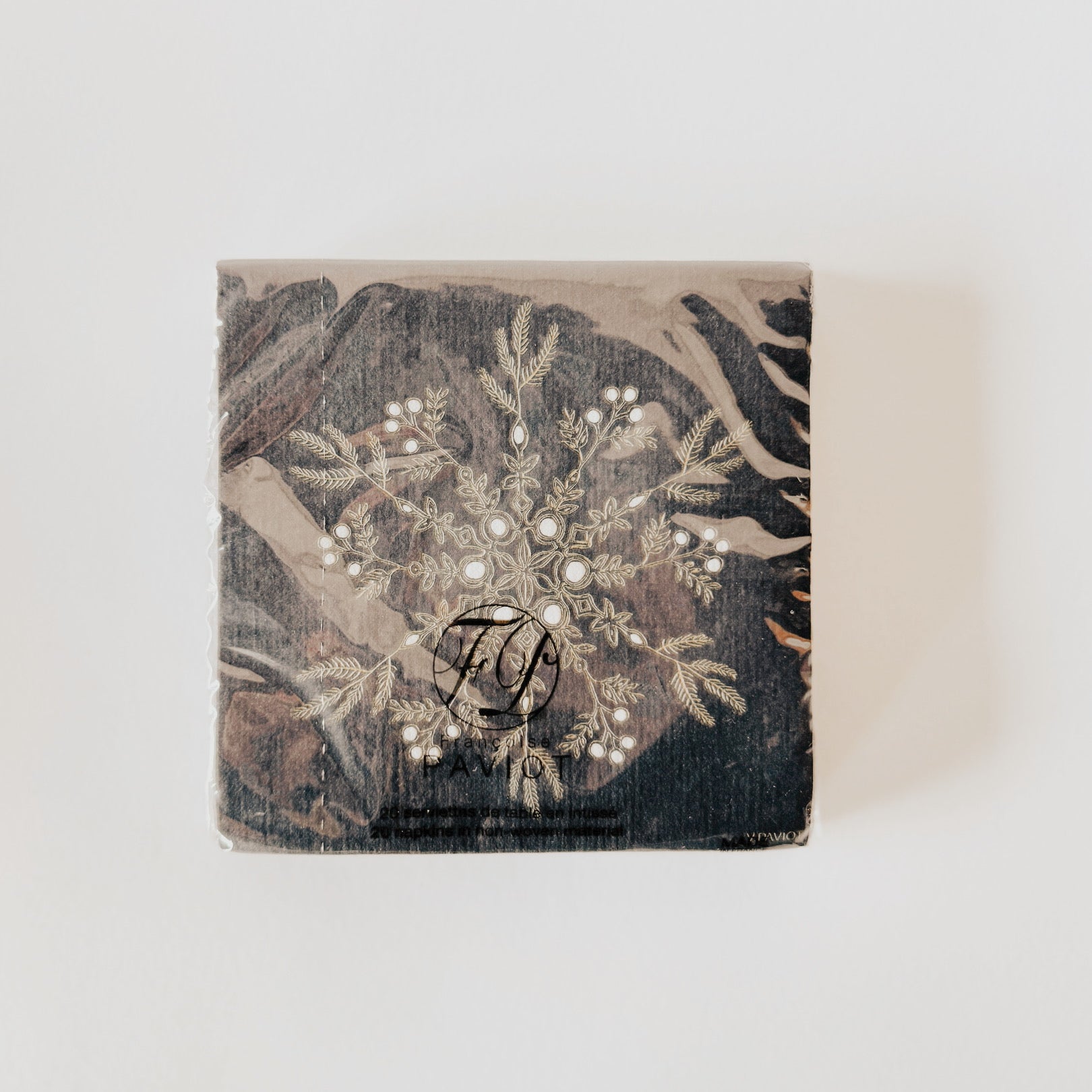 A set of Paviot - Dinner Napkins by Grace & Company, featuring a floral pattern and monogram, on a white background.