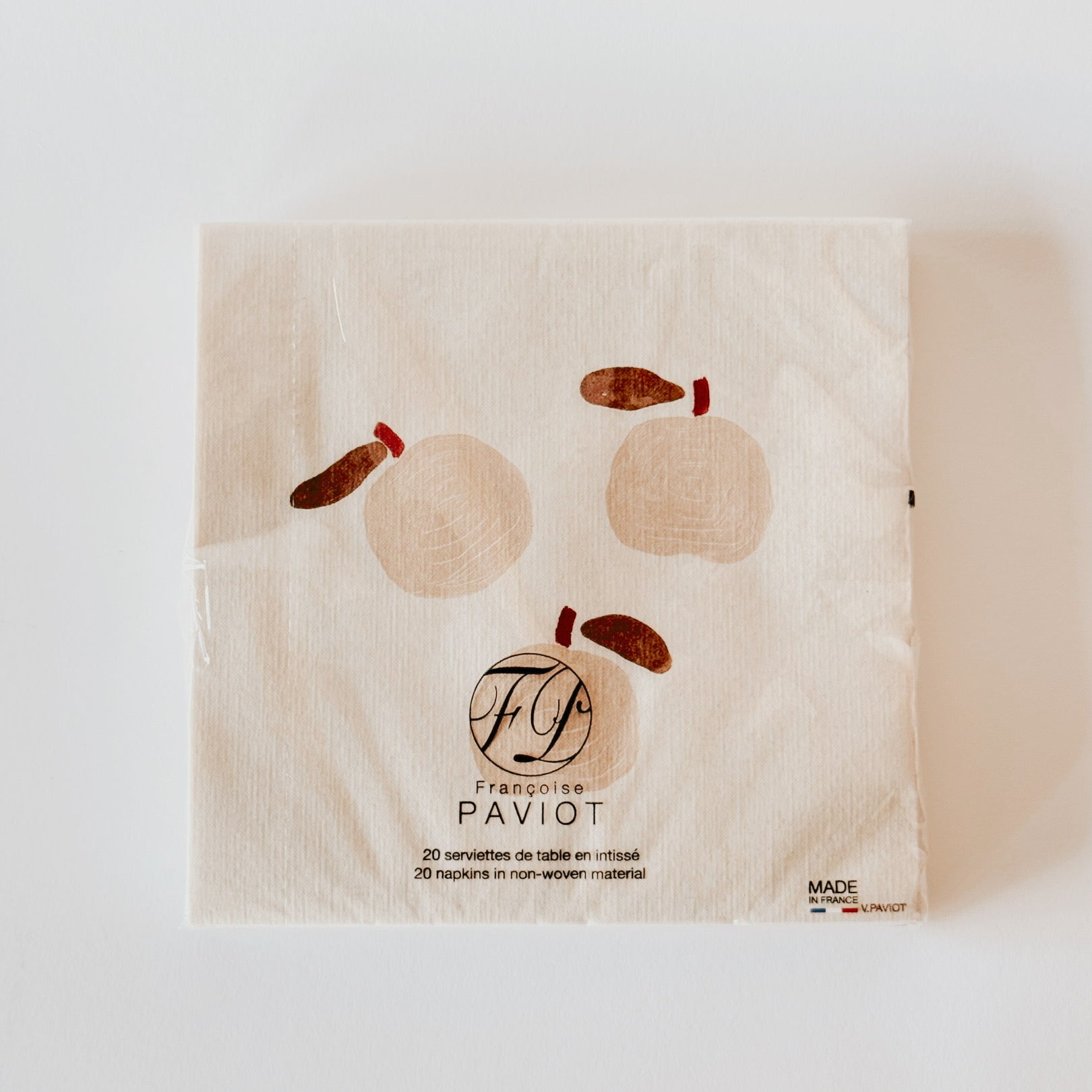 A beige Paviot - Pomme Dinner Napkin pack with abstract fruit designs by Grace & Company.