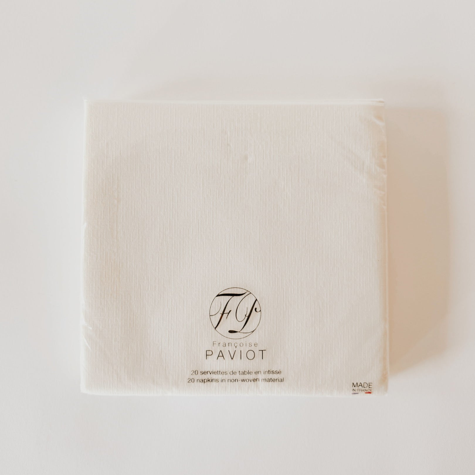 A pack of Paviot - Classic Pure White napkins by Grace and Company Ltd on a plain white background.