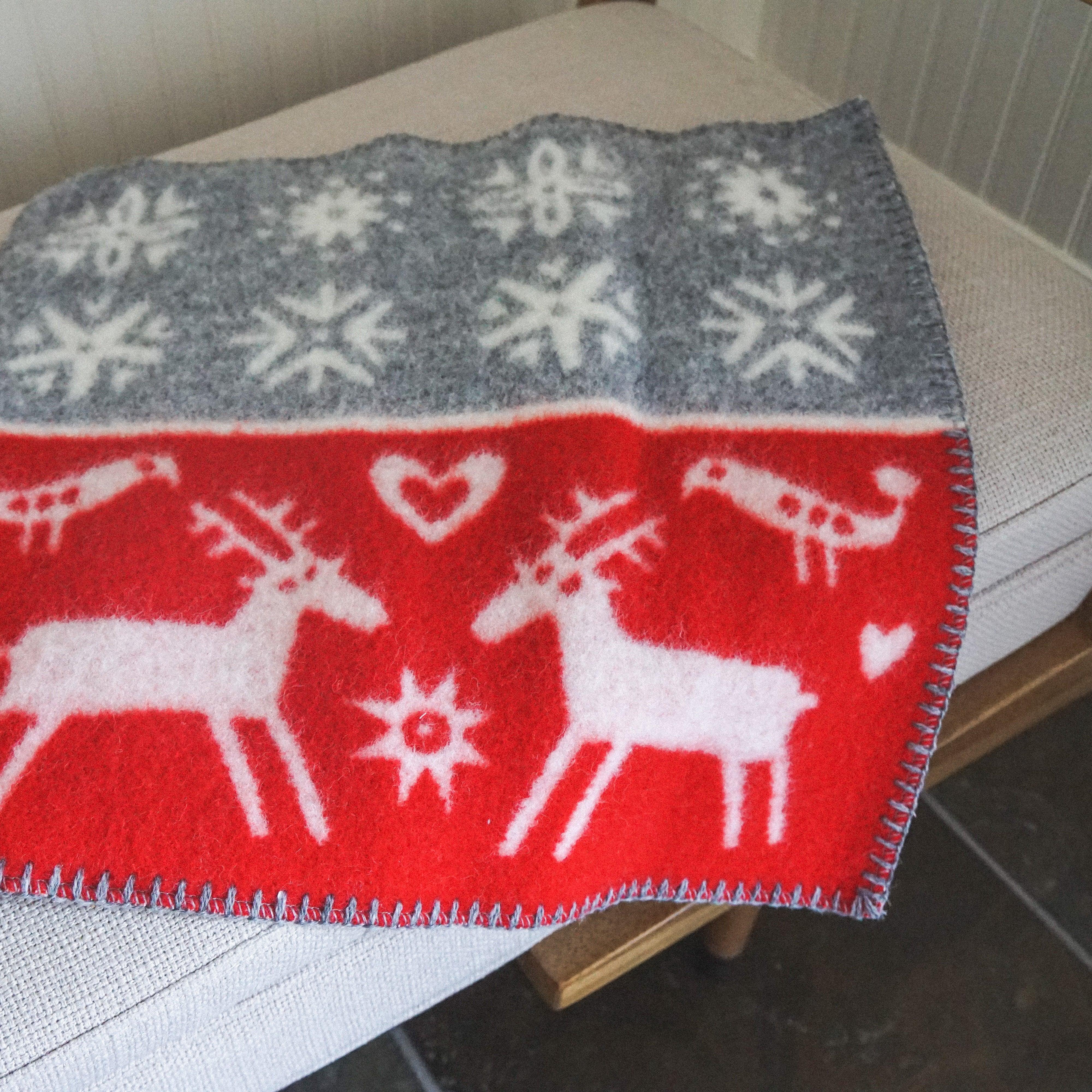 Klippan - Lambs Wool Mini Blanket by Grace & Company, red/gray with white reindeer, birds, hearts, and snowflakes.