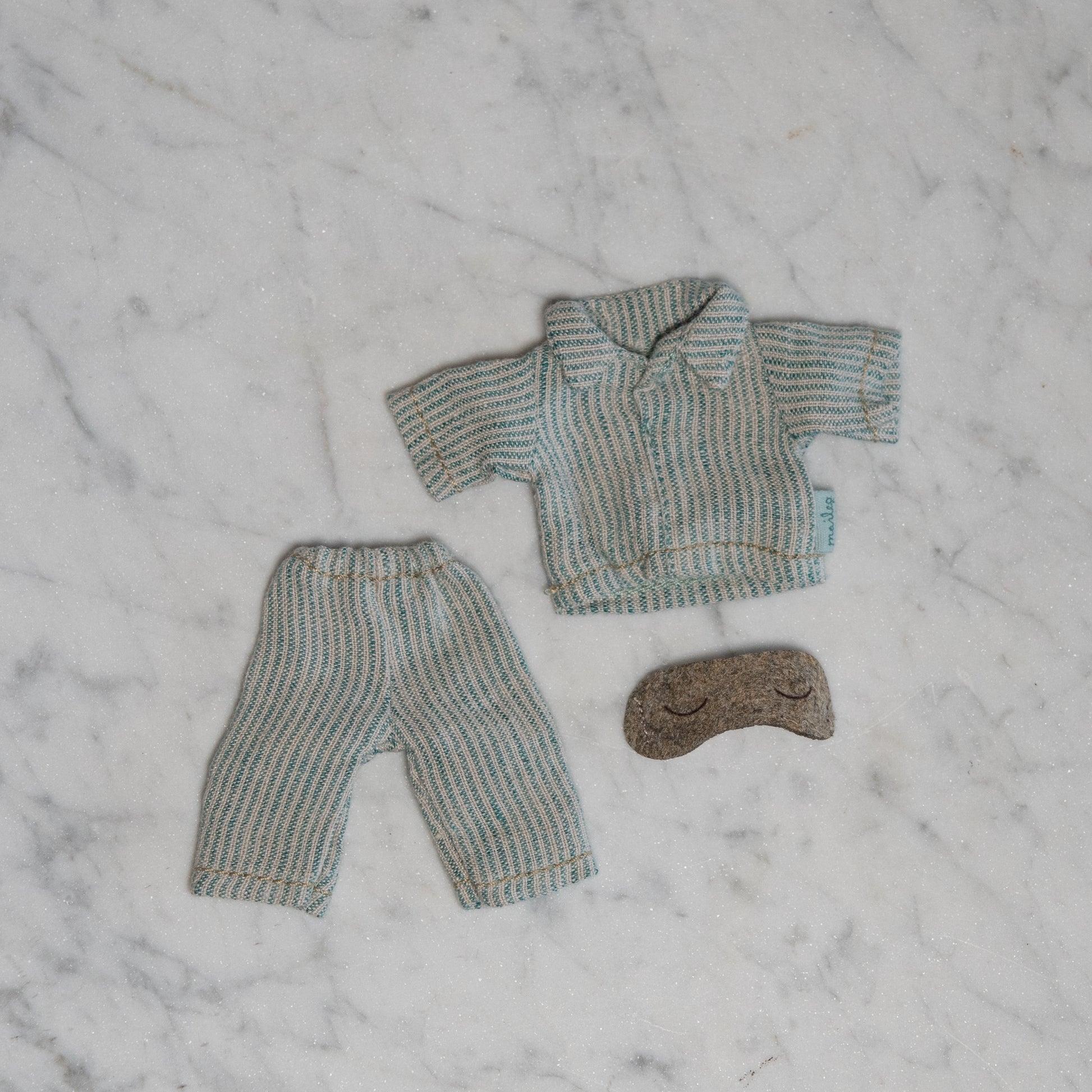 Maileg - Clothing for Mice by Grace & Company: striped doll pajamas with shirt, pants, and brown eye mask on marble.