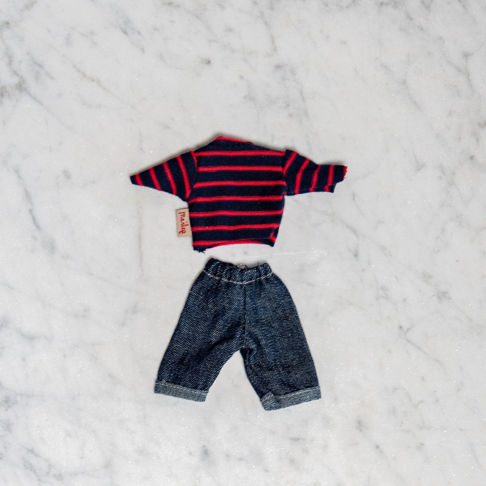 Maileg - Clothing for Mice by Grace & Company: a small striped sweater and denim jeans on white marble.