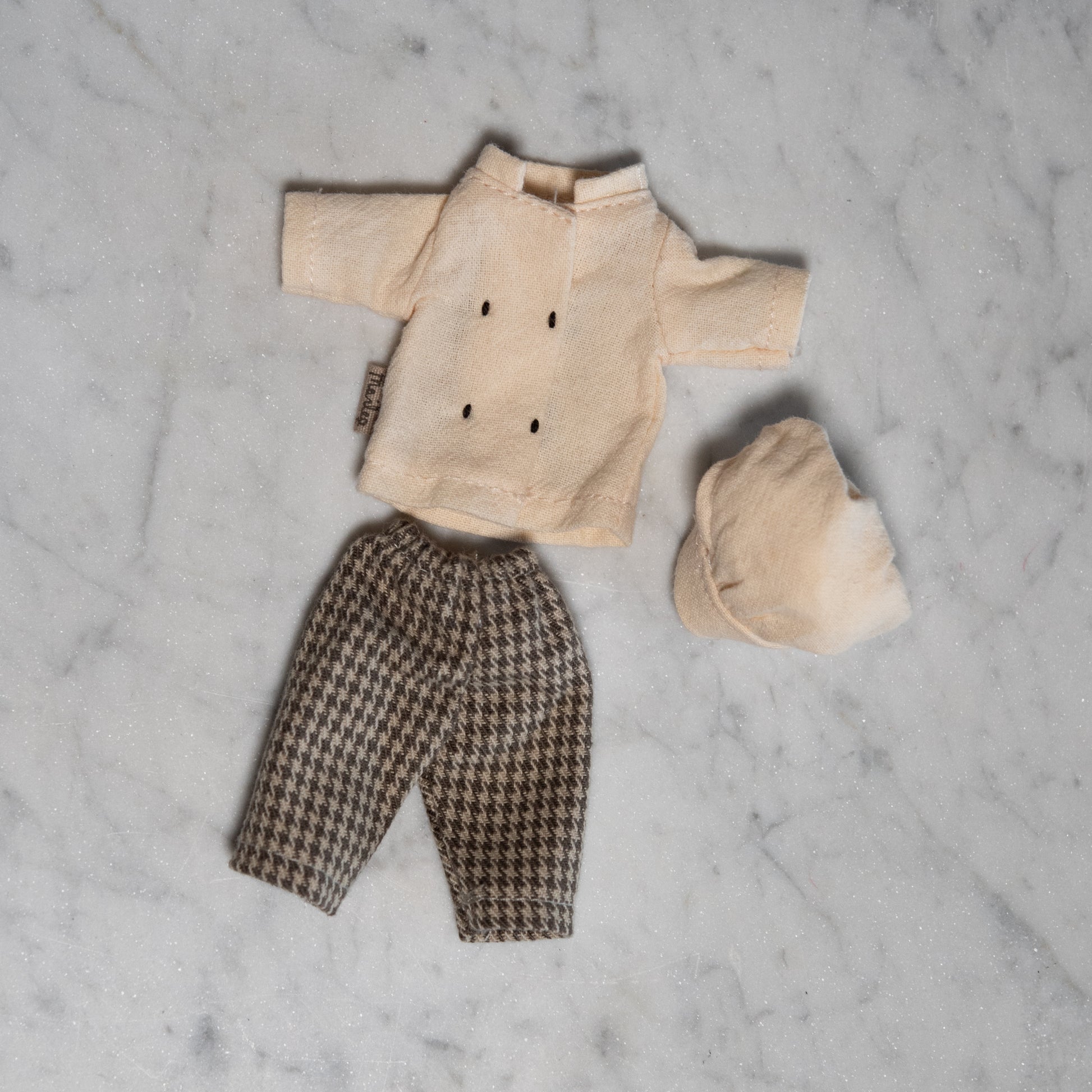 Maileg - Clothing for Mice by Grace & Company: cream shirt, hat, and houndstooth pants on a marble surface.