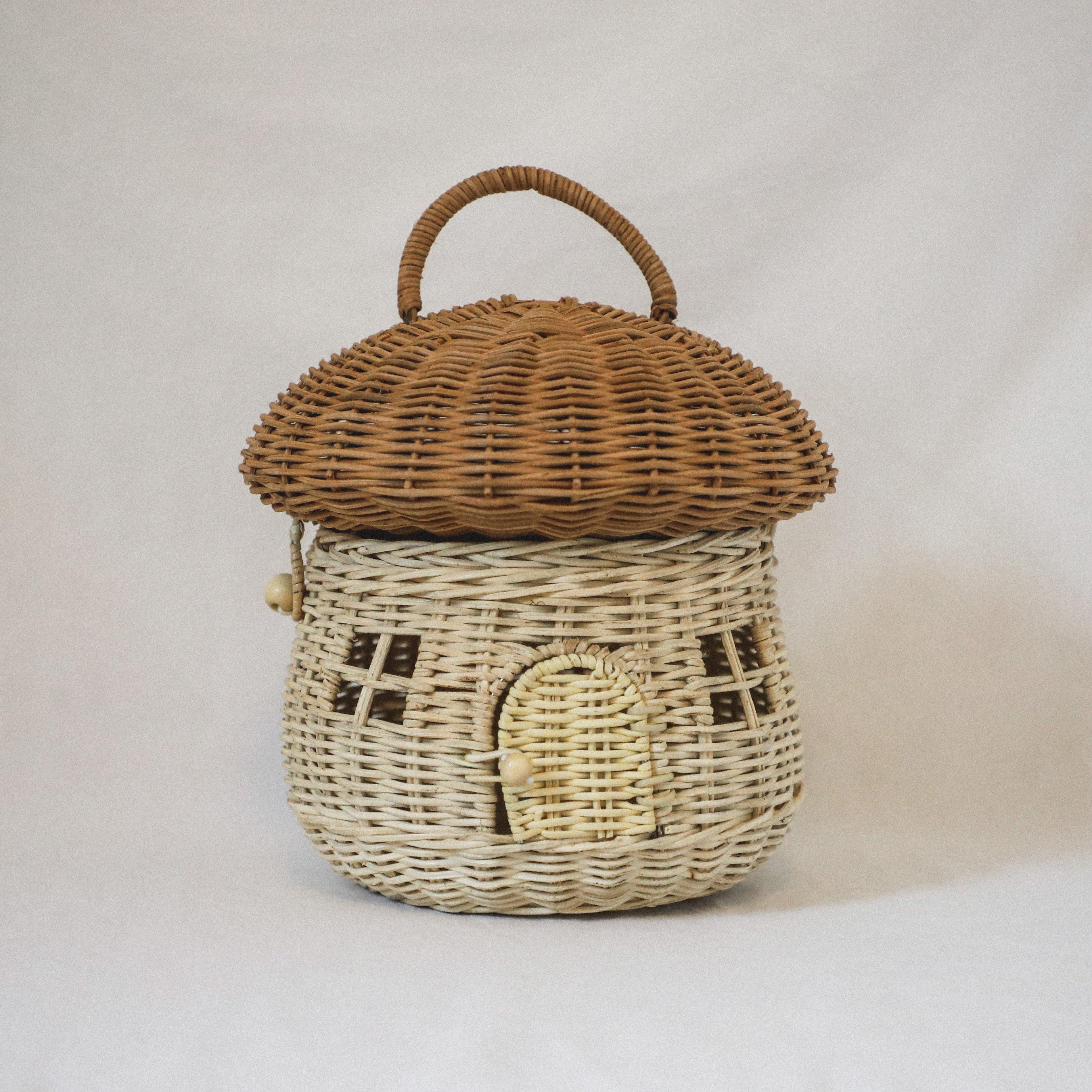 The Grace & Company Olli Ella Mushroom Basket is a woven wicker basket shaped like a mushroom house with handle and windows.