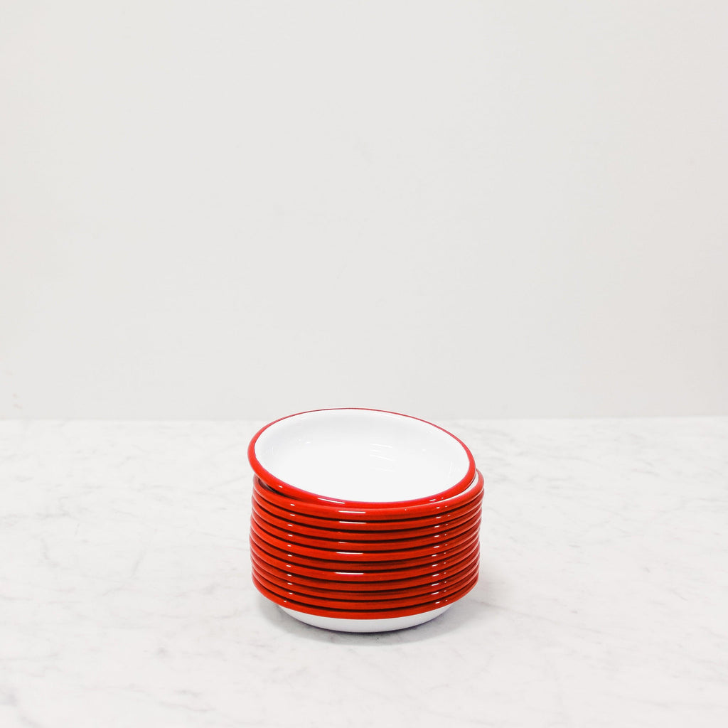 stack of red enamel tapas plates from Falcon Enamelware