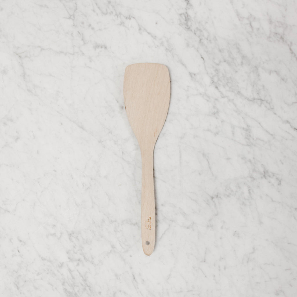 above view of wooden curved spatula