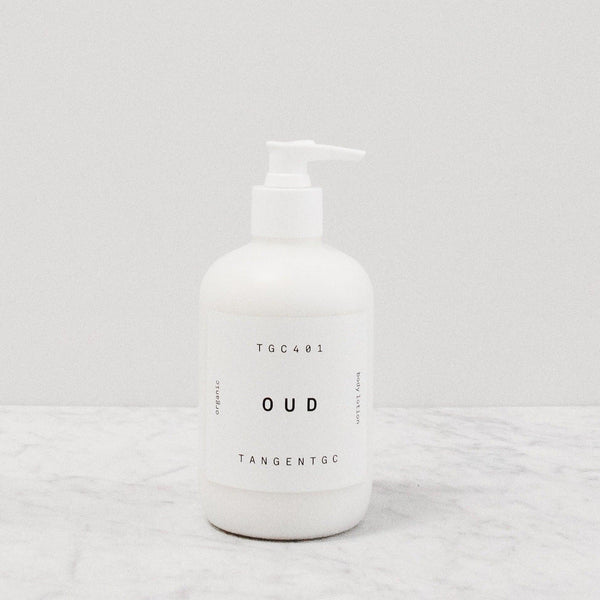 Tangent GC Oud scented body lotion in a pump bottle