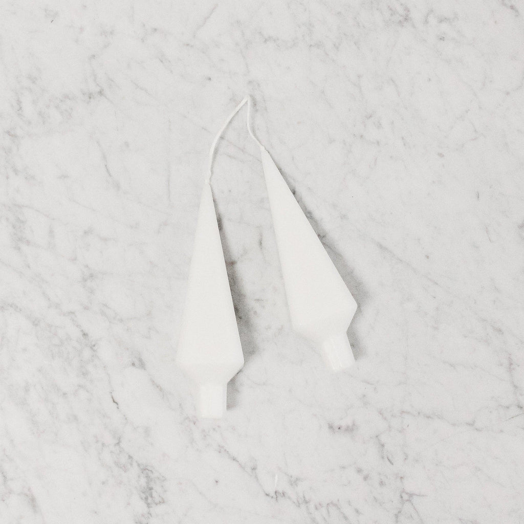 pair of stylized tree shaped candles in white