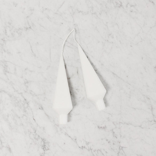 pair of stylized tree shaped candles in white