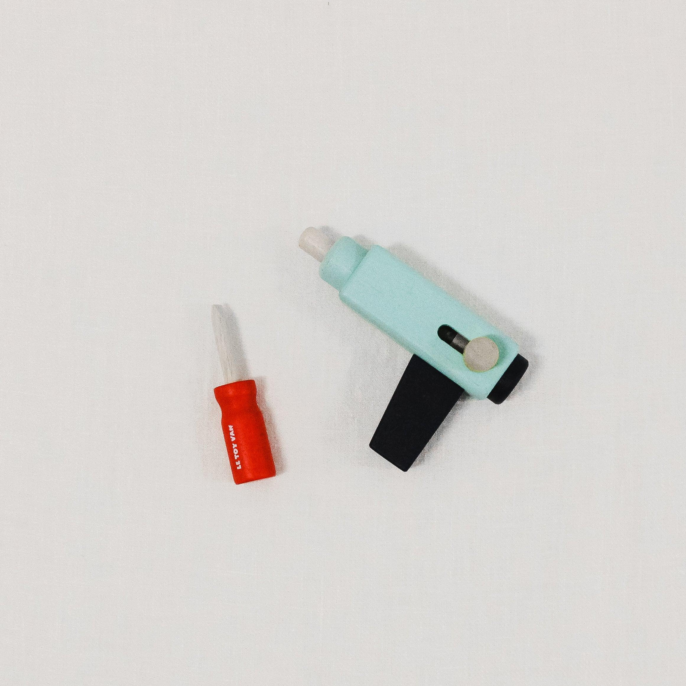 Le Toy Van - Tool Set by Grace & Company ltd, featuring a small red screwdriver and blue tool, on a white surface.