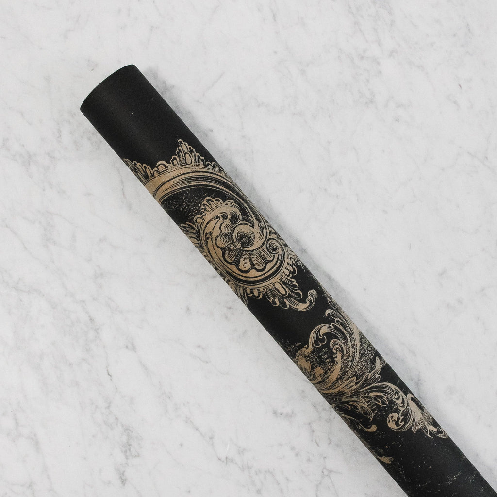 black paper table runner with an archival vintage print