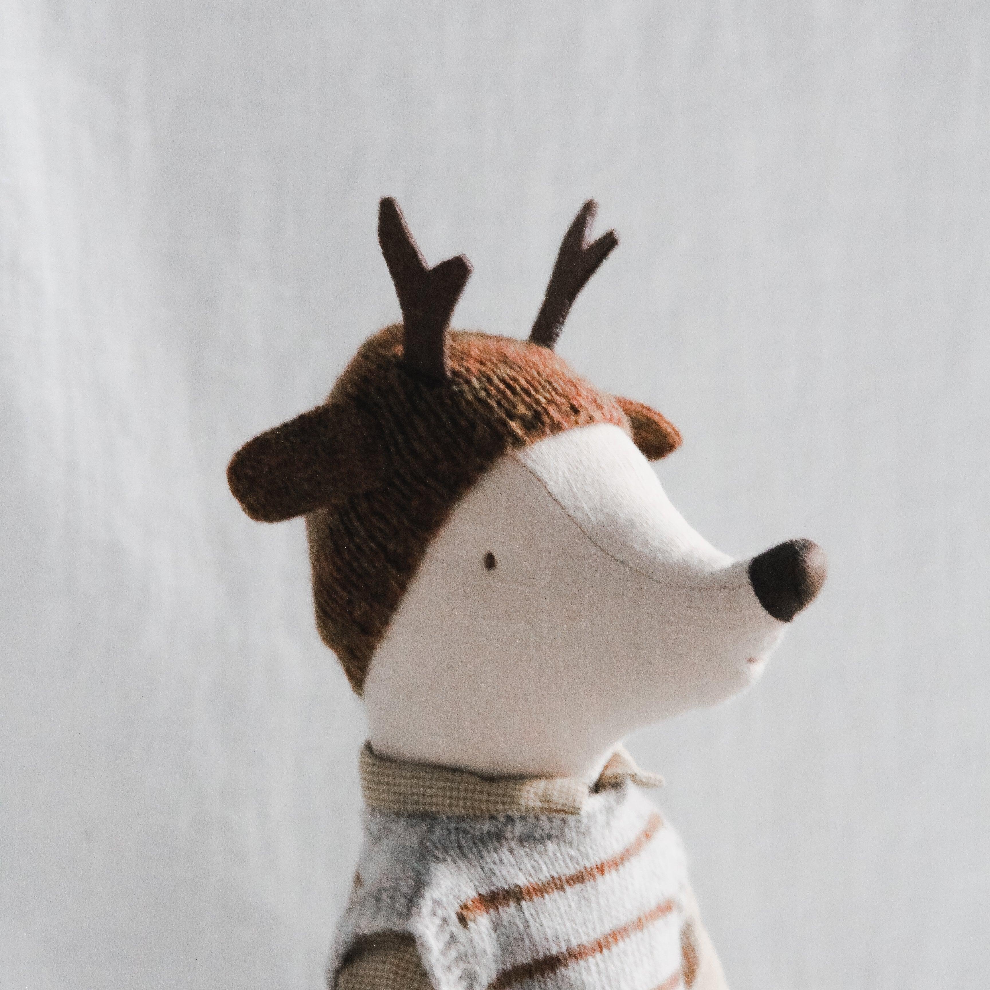 The Maileg - Maxi Mouse Boy by Grace & Company wears a striped shirt and antler hat, set on a plain white background.