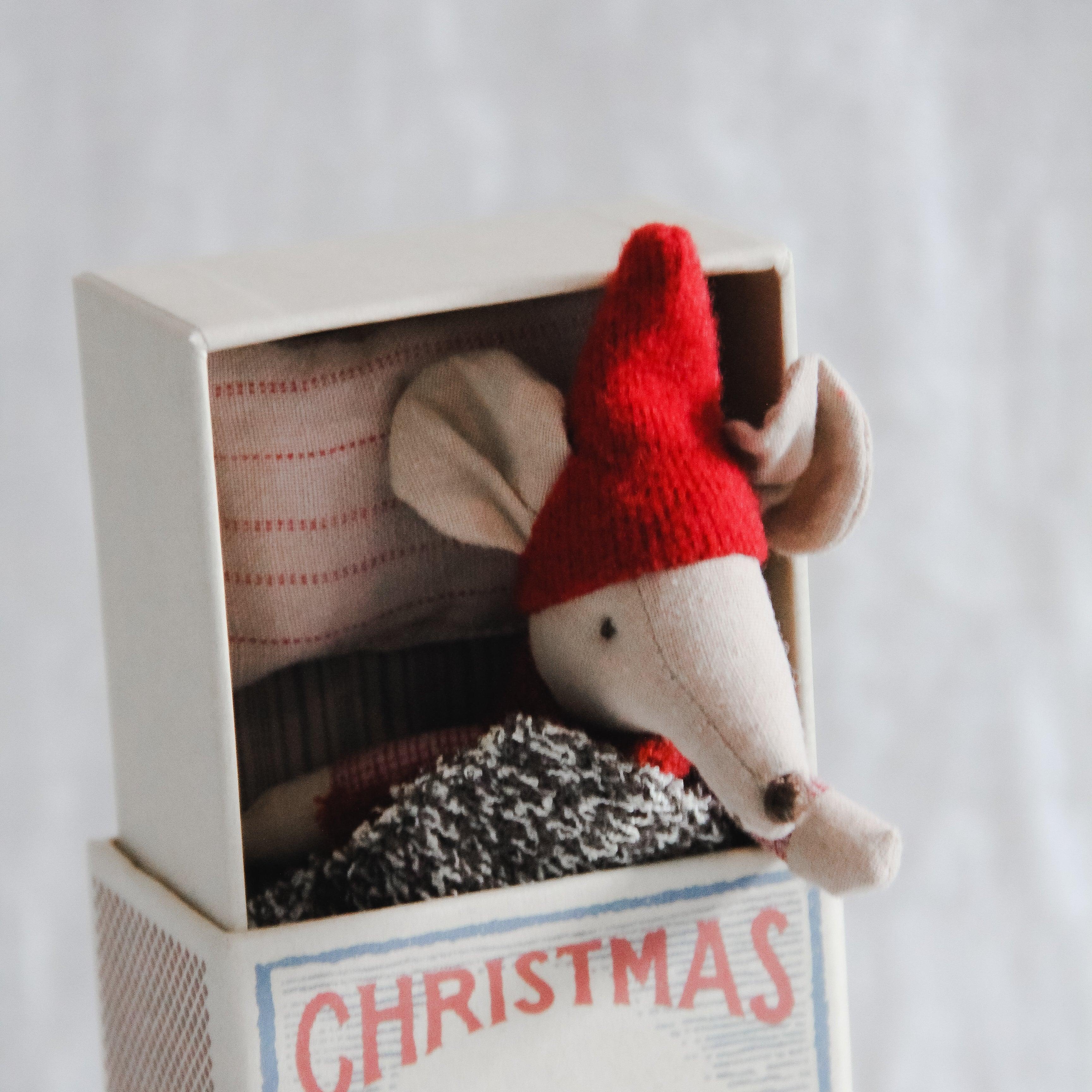 Grace & Company Maileg Big Brother Christmas Mouse in Matchbox peeks out with a cozy blanket and red hat.