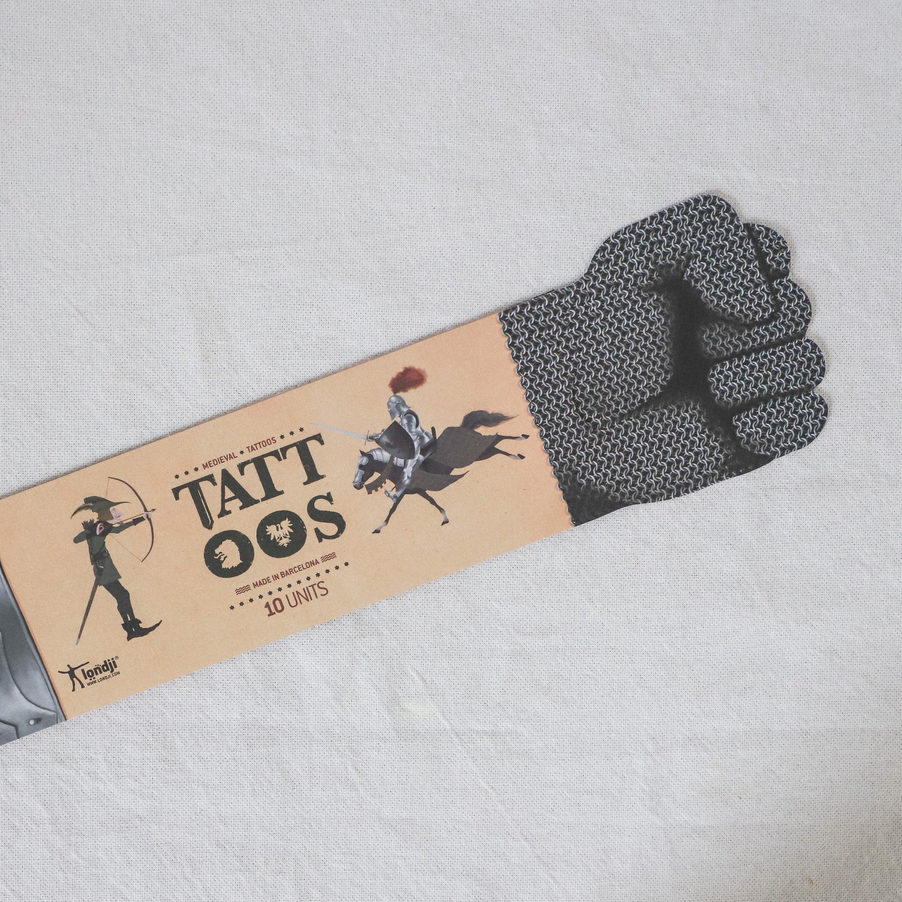 Grace & Company’s Moulin Roty - Medieval Tattoos feature a chainmail glove design on the packaging.