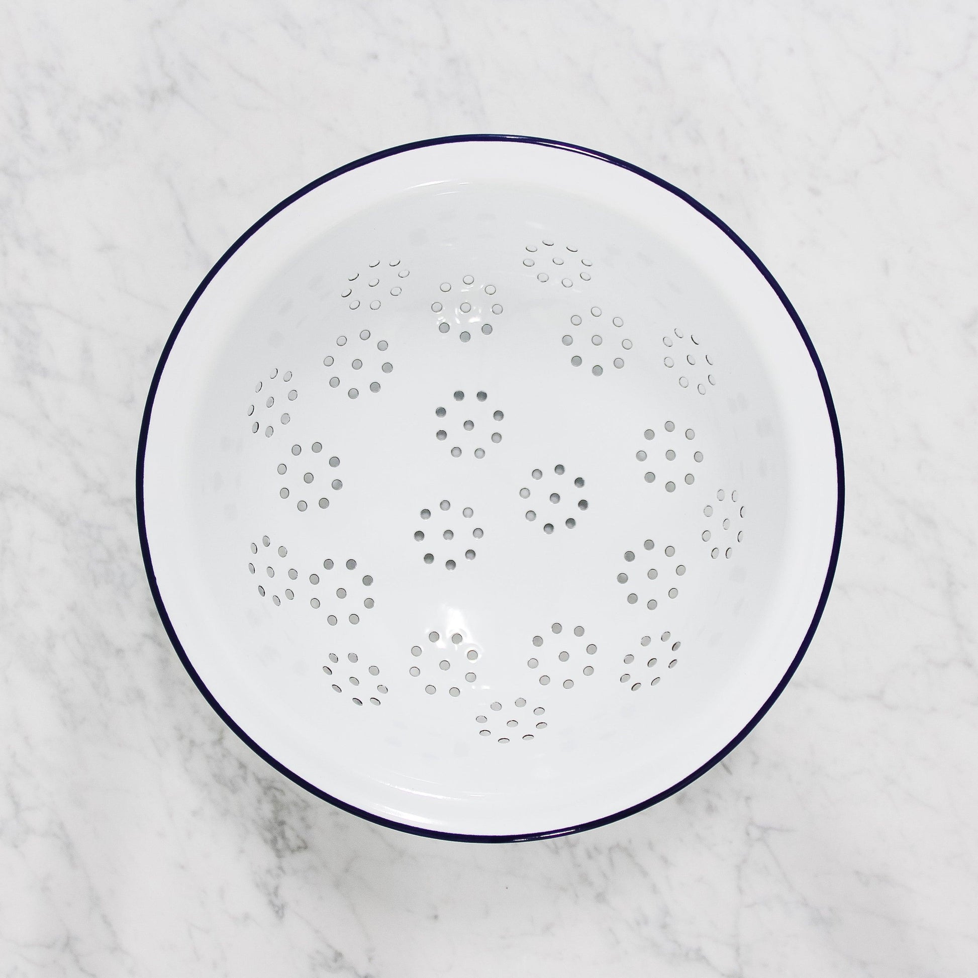 white enamel colander by Falcon enamelware