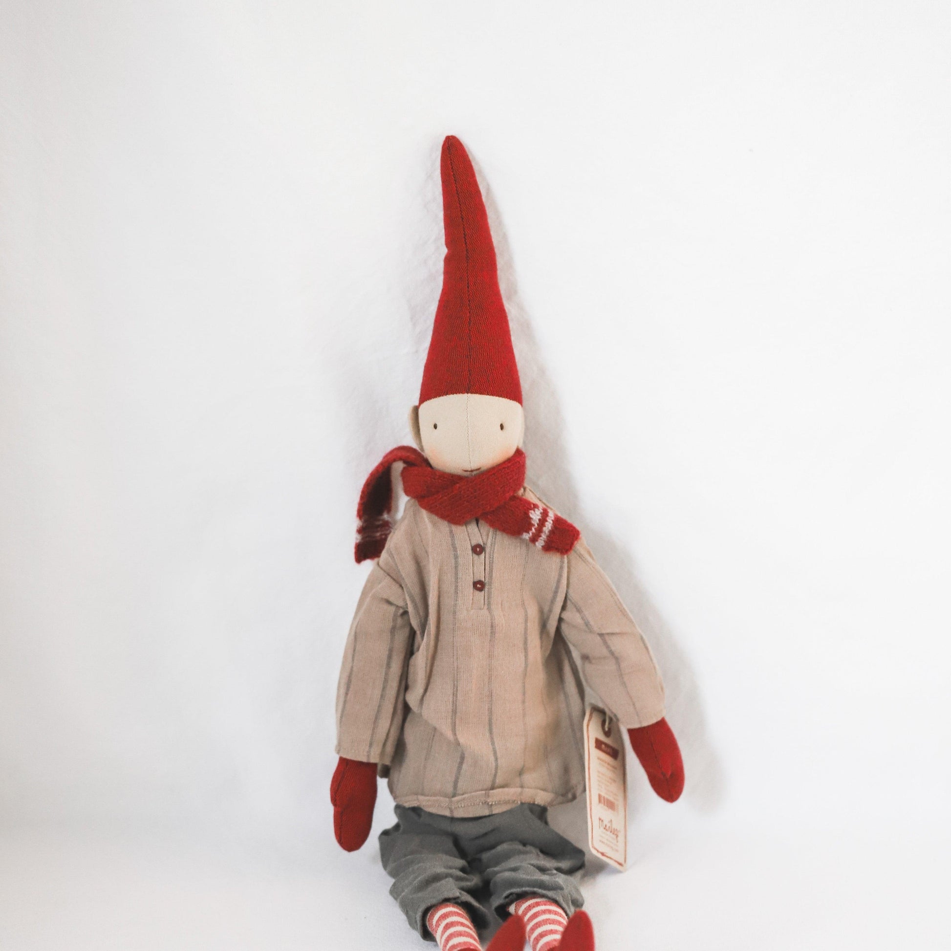 Maileg - Pixy Collection Christmas doll by Grace & Company wears a red hat, scarf, mittens, and striped socks.