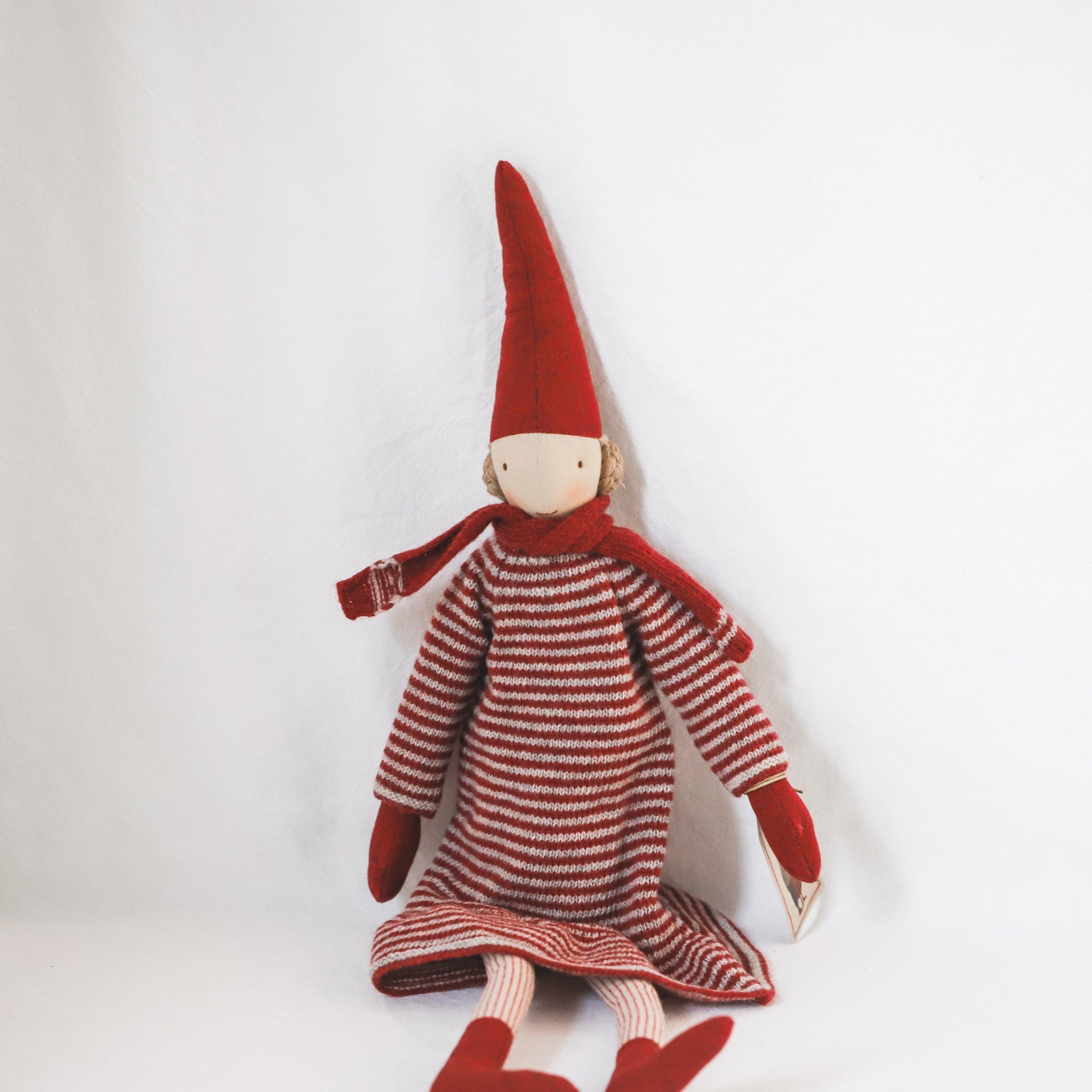 The Maileg - Pixy Collection Christmas doll by Grace & Company sits in festive red attire against a white background.