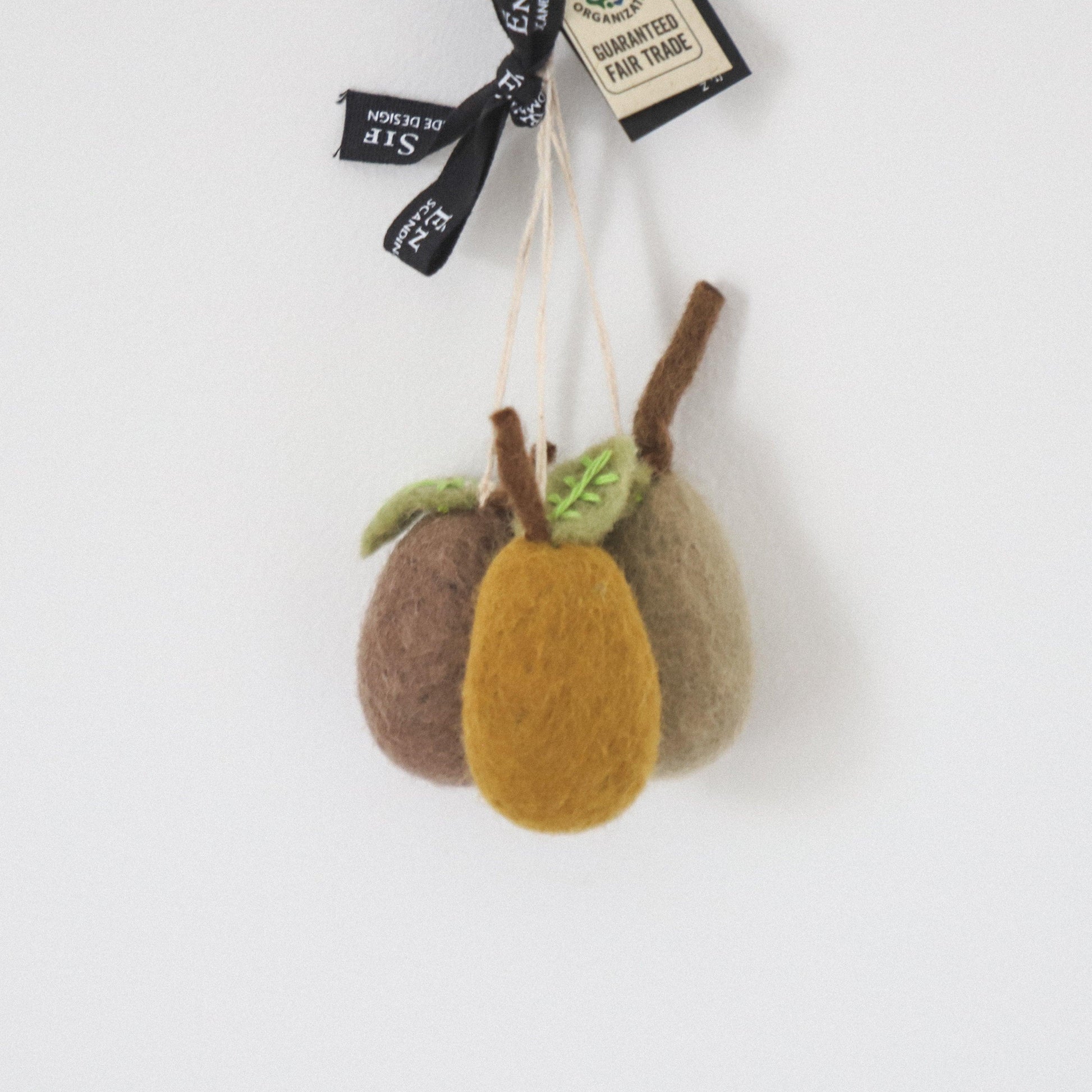 Three Scandi Felted Pears Ornaments by Grace and Company Ltd hang from strings against a white background.