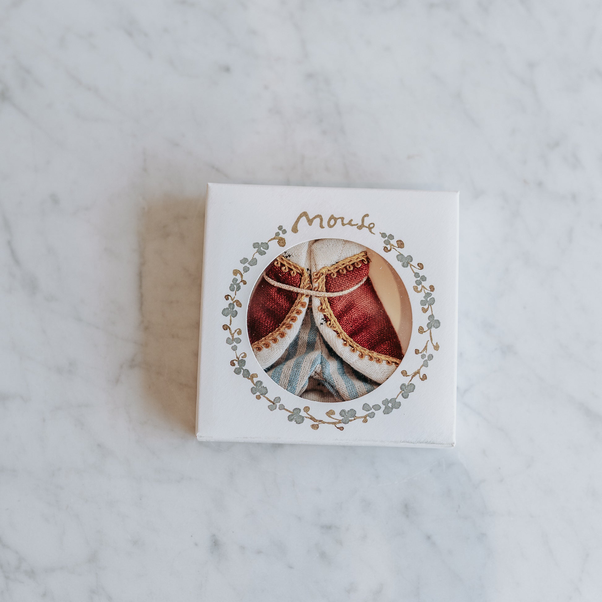 Grace & Company Maileg - Clothing for Mice in small white box with round window on a marble surface.