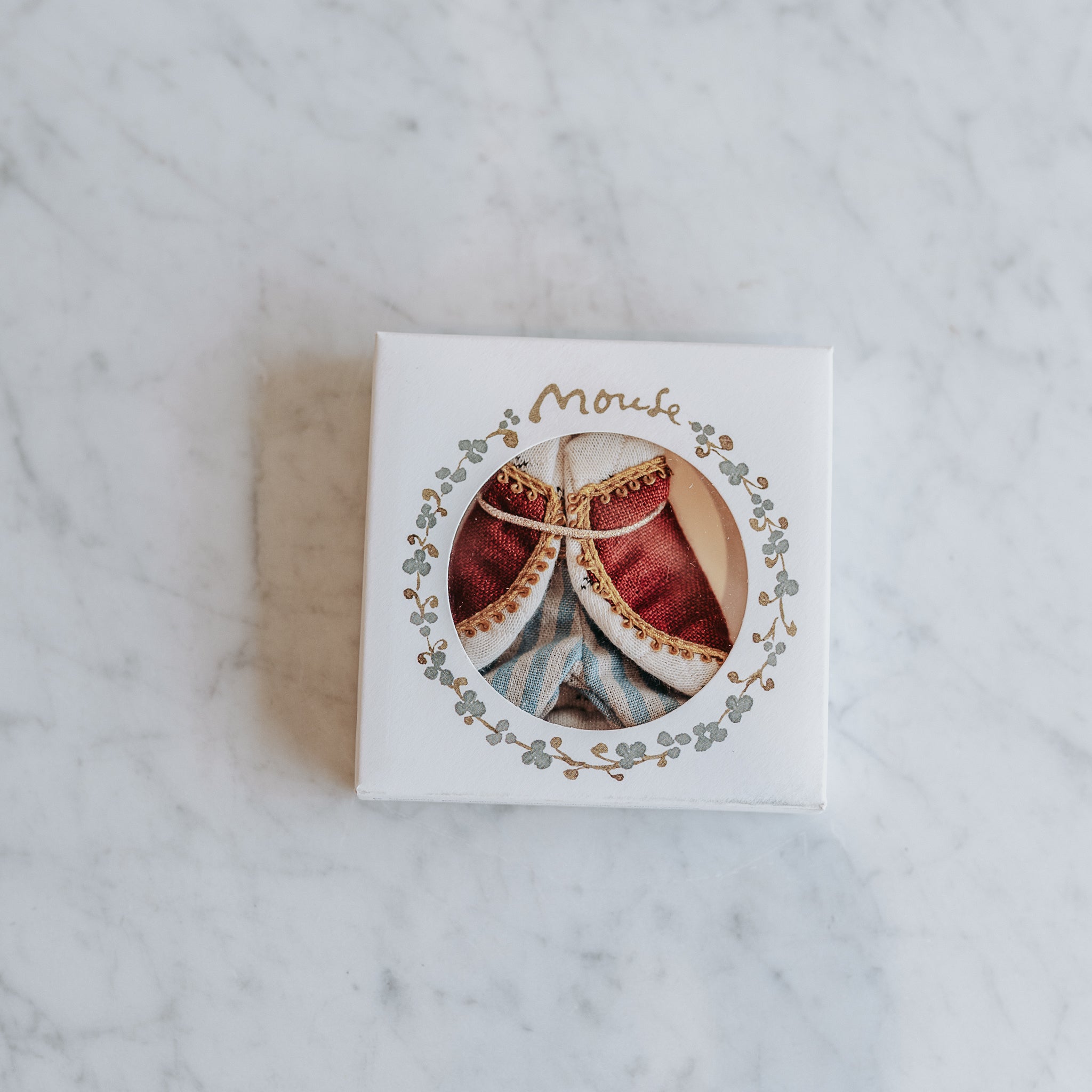 Grace & Company Maileg - Clothing for Mice in small white box with round window on a marble surface.